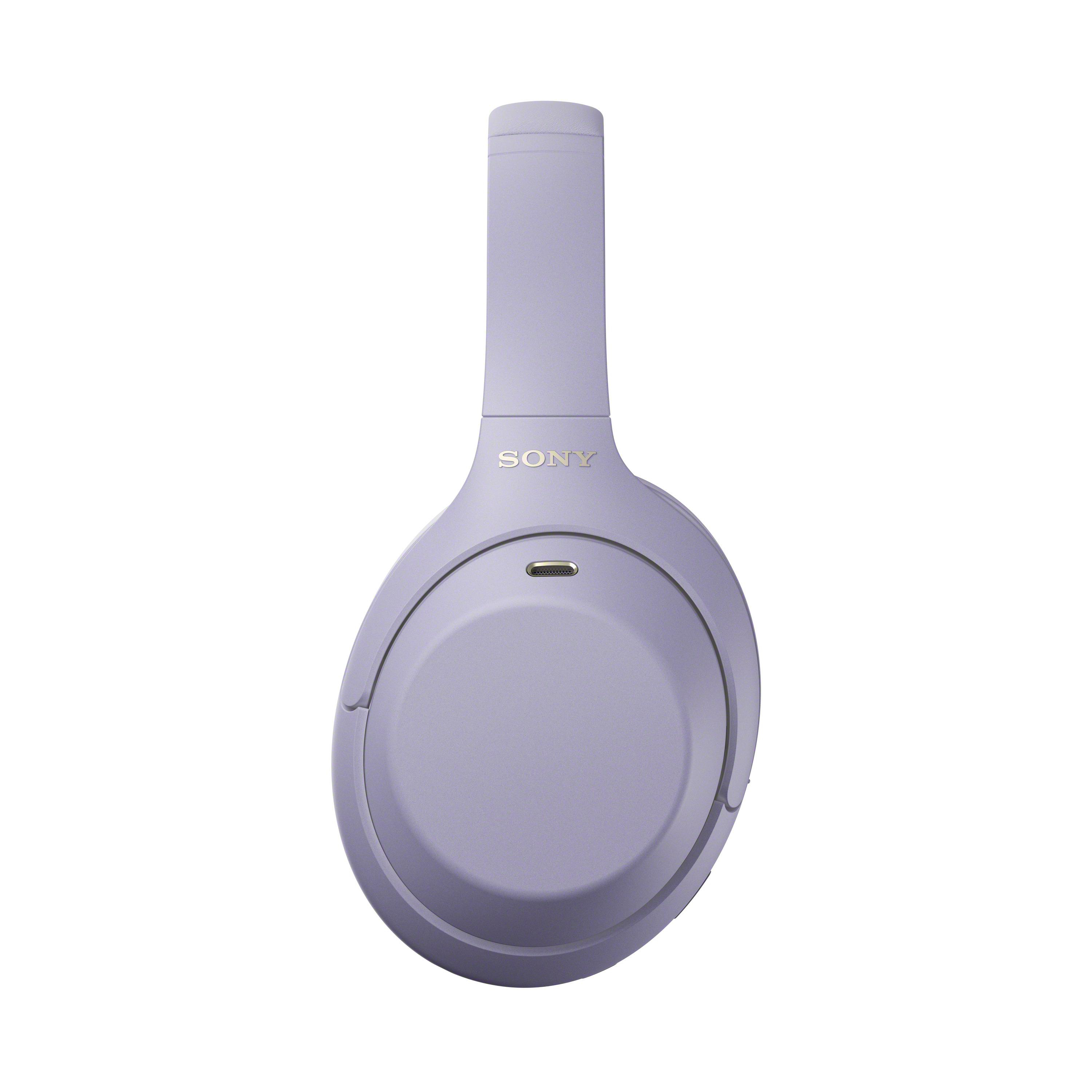Lilafarbene Sony Over-Ear-WLAN-Kopfhörer von der Seite vor weißem Hintergrund.