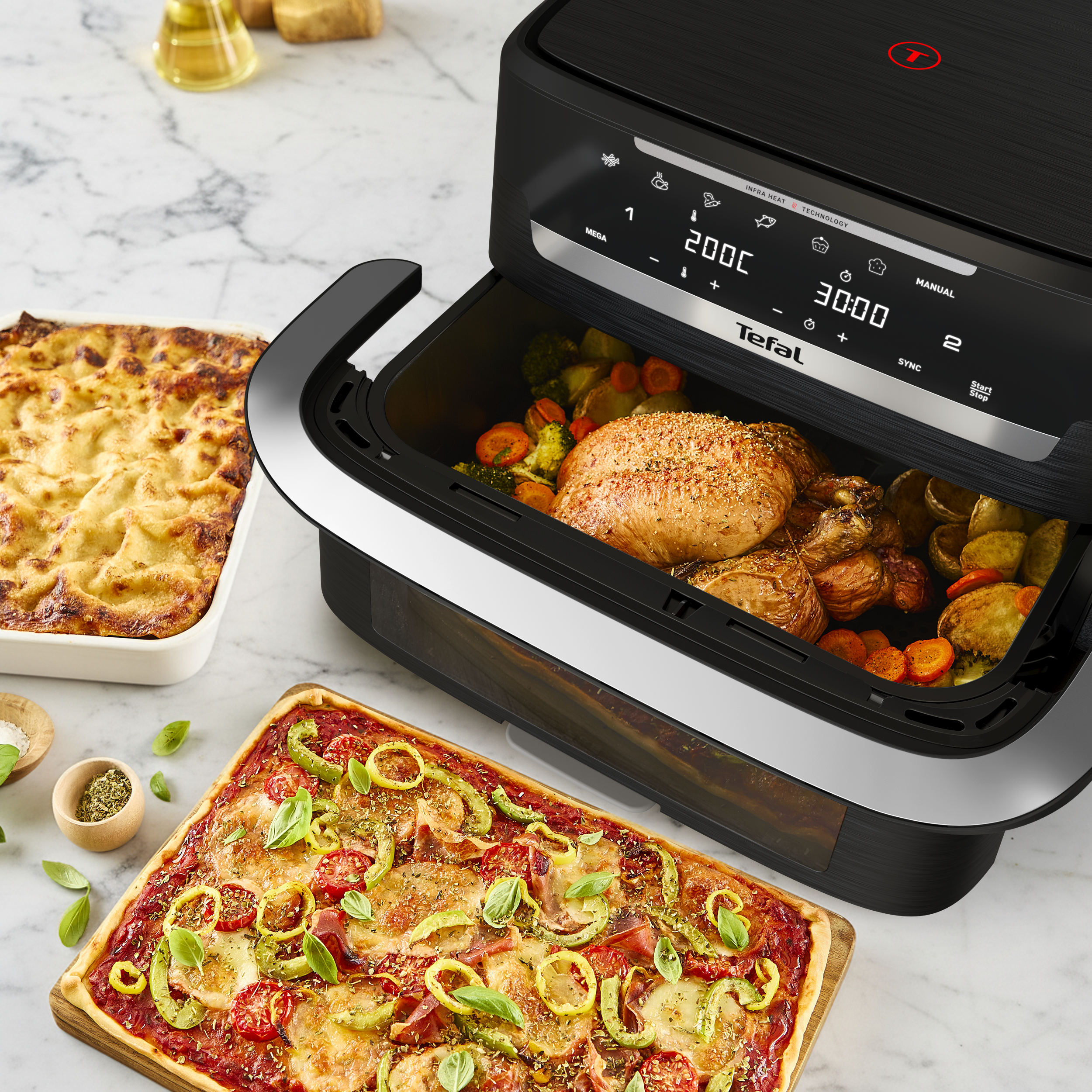 Forrólevegős fritőz csirkével és zöldséggel, pizzával és rakott étellel.