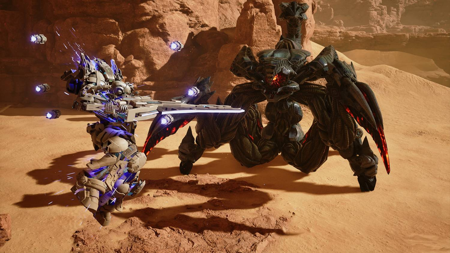 Un robot futurista lucha contra un monstruo gigante parecido a un escorpión en un desierto rocoso.