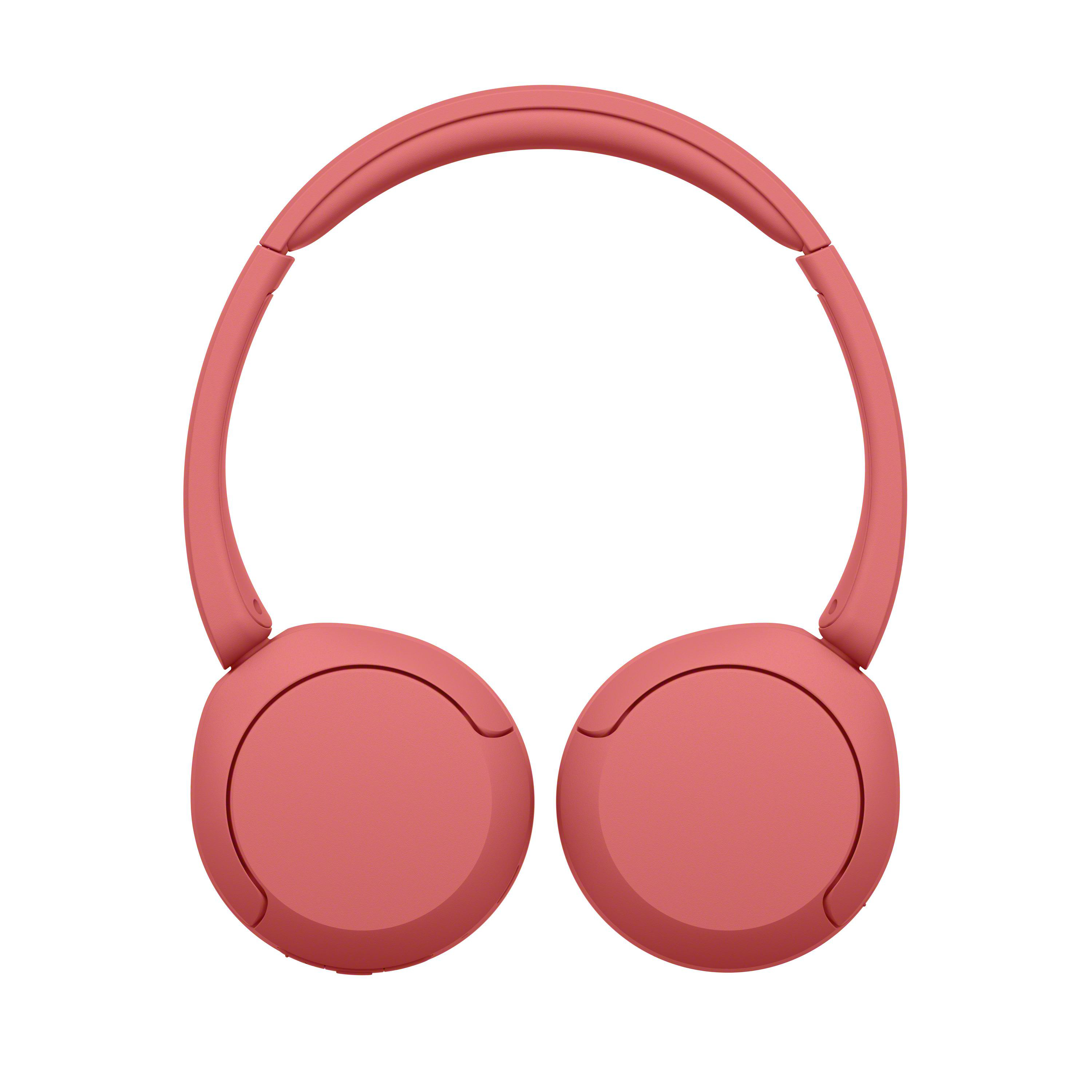 Moderne, pinke On-Ear-Kopfhörer vor einem weißen Hintergrund.