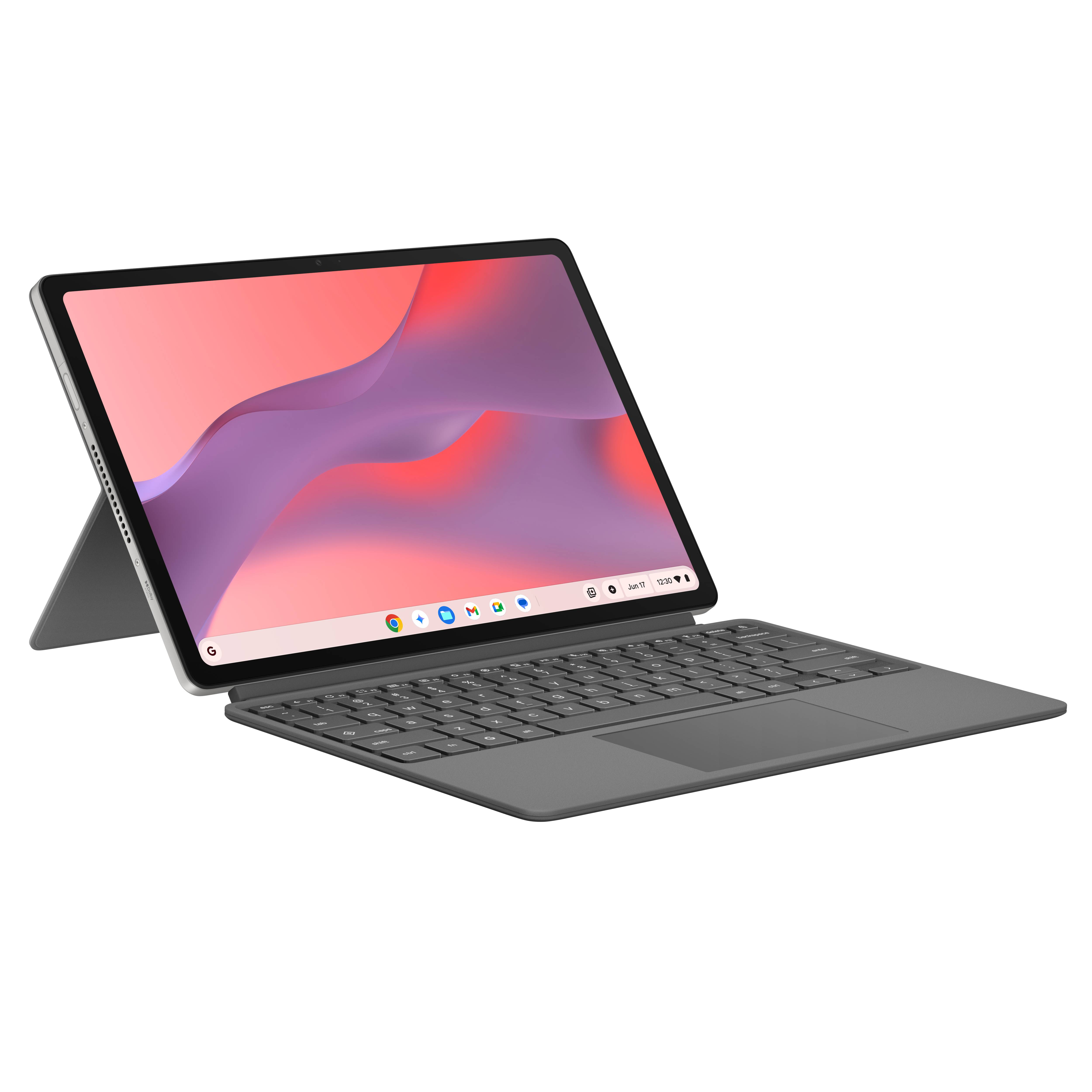 Una tableta gris con teclado adjunto y soporte, apoyada sobre una superficie blanca.