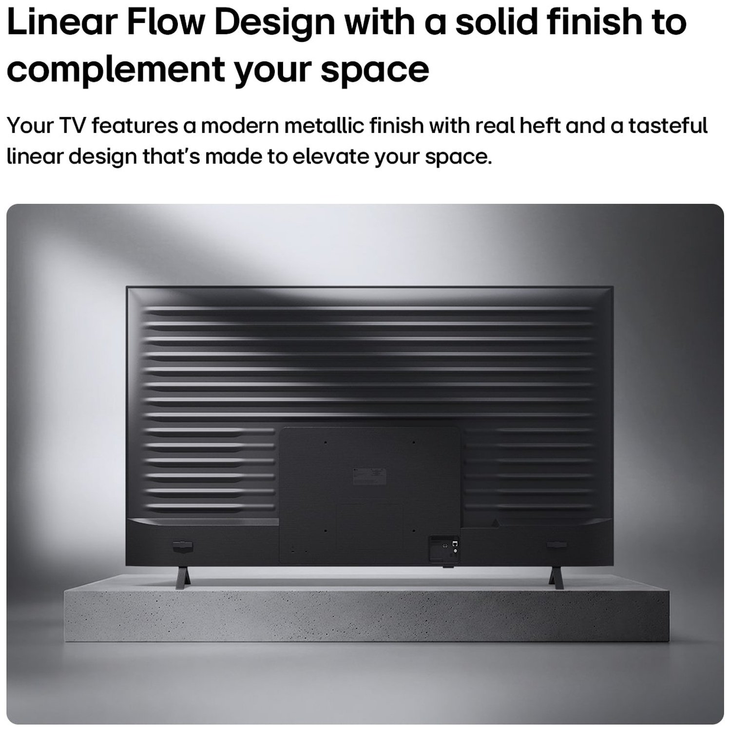 Back of a black television with linear design on a light pedestal.