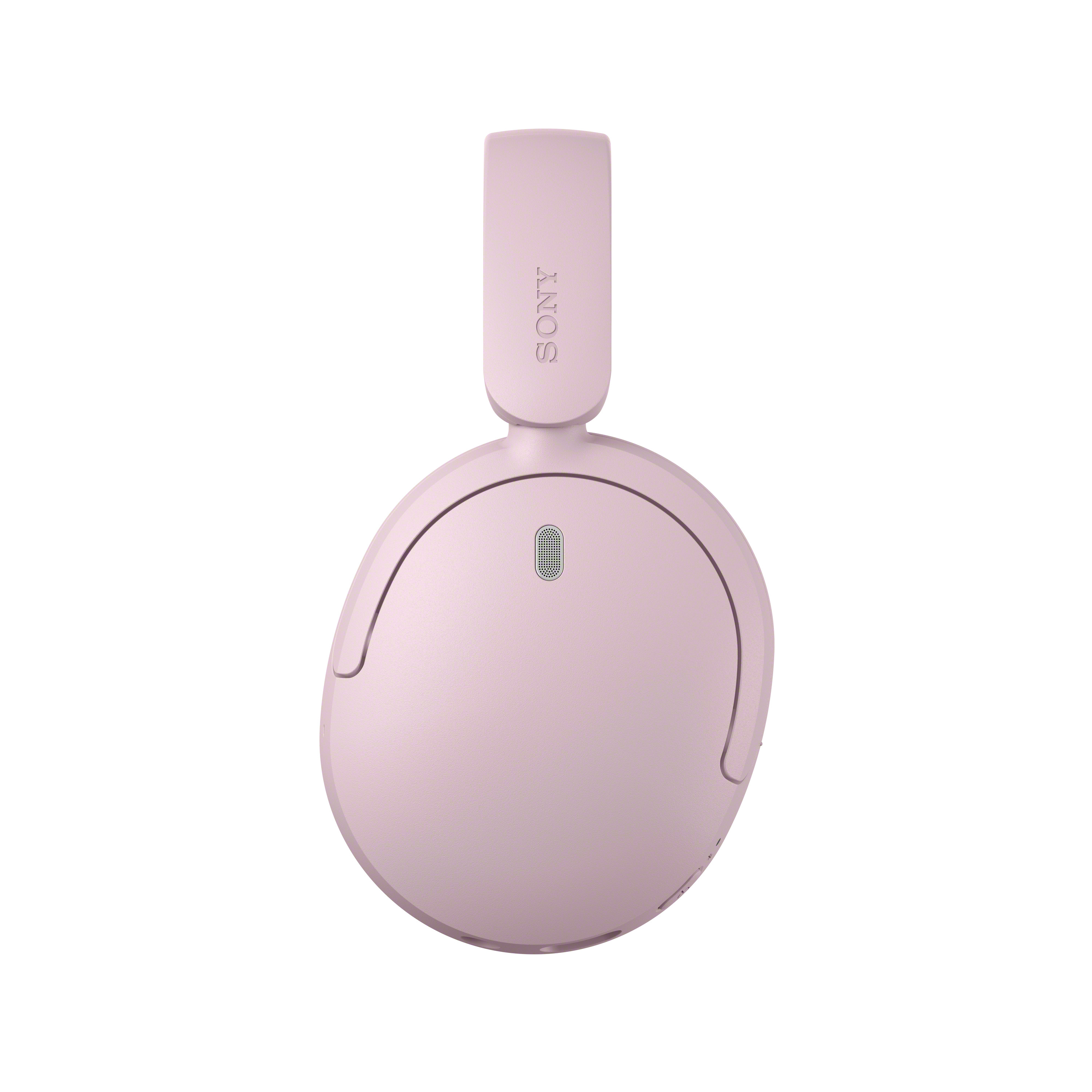 Casque supra-auriculaire Sony rose centré sur fond blanc, avec fente de microphone sur l'écouteur.