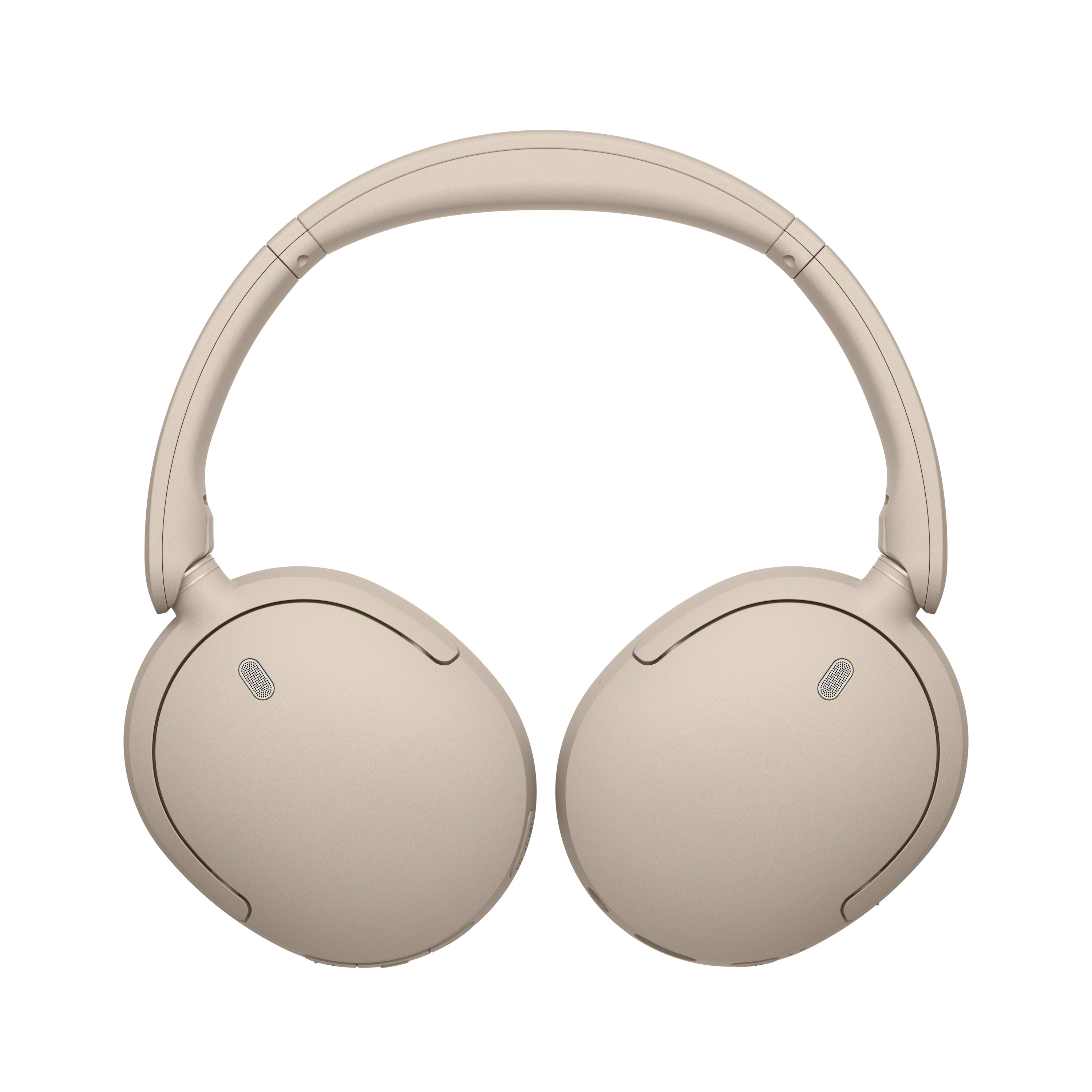 Casque sans fil circum-auriculaire beige sur fond blanc.