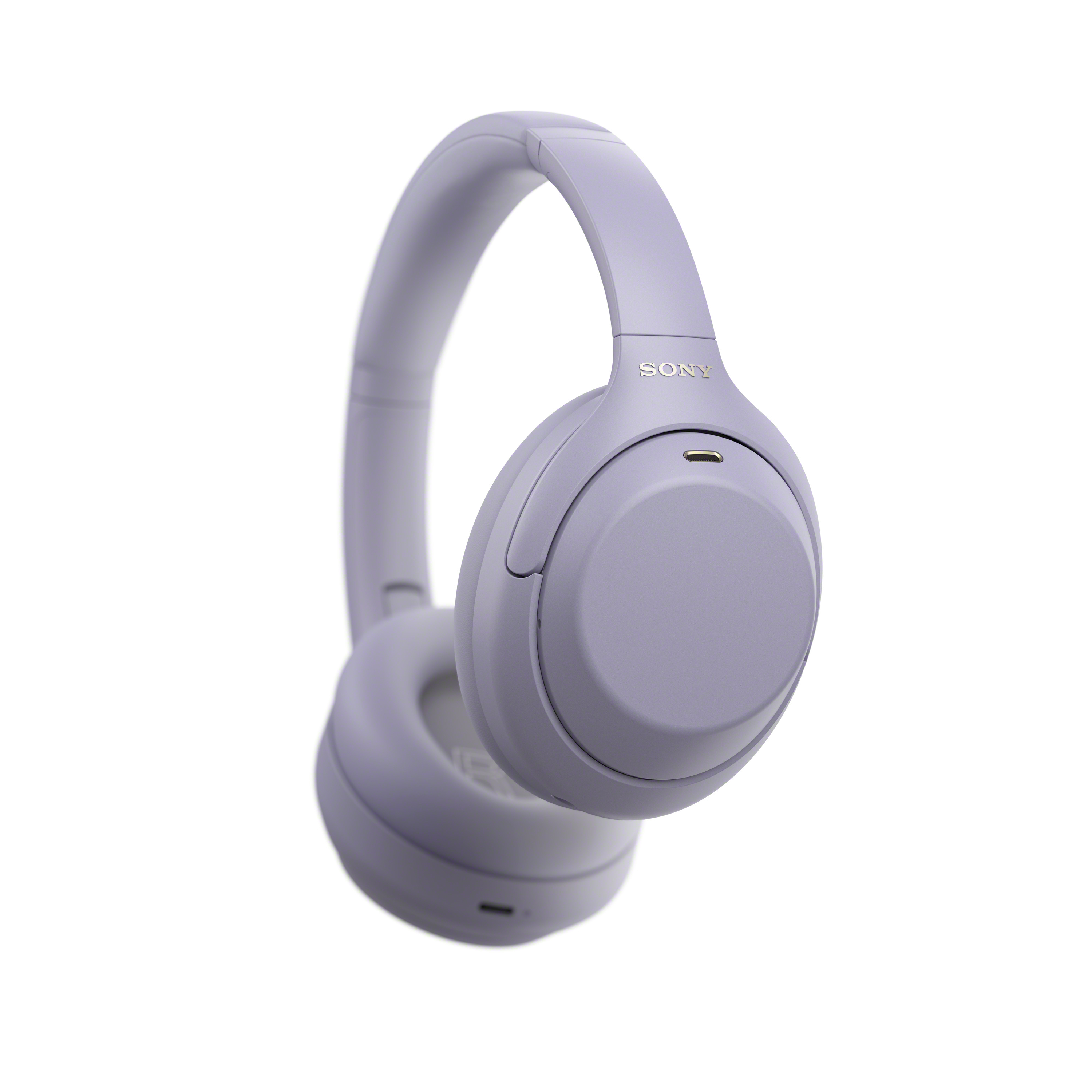 Hellviolette kabellose Sony Over-Ear-Kopfhörer vor weißem Hintergrund.