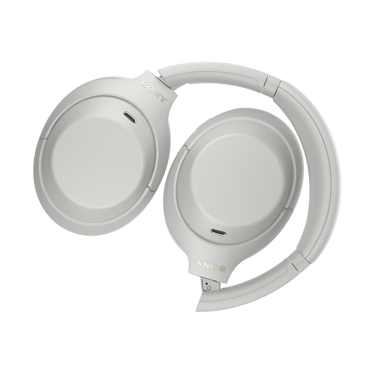 Un paio di cuffie over-ear Sony bianche, piegate su sfondo bianco.