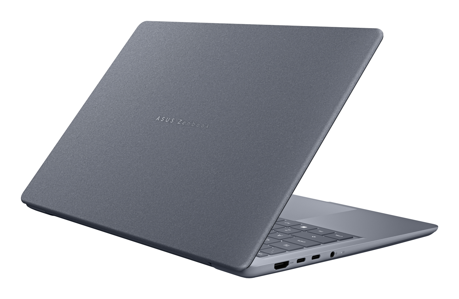 Un portátil Asus Zenbook gris abierto visto desde la parte trasera derecha, mostrando el teclado y puertos sobre fondo blanco.