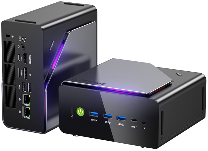 Két fekete mini PC színes LED-ekkel, USB-portokkal és bekapcsológombbal.
