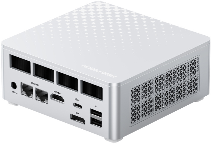 Ezüst színű mini PC hátoldalán különféle portokkal, szellőzőrácsokkal és mintás felső felülettel.
