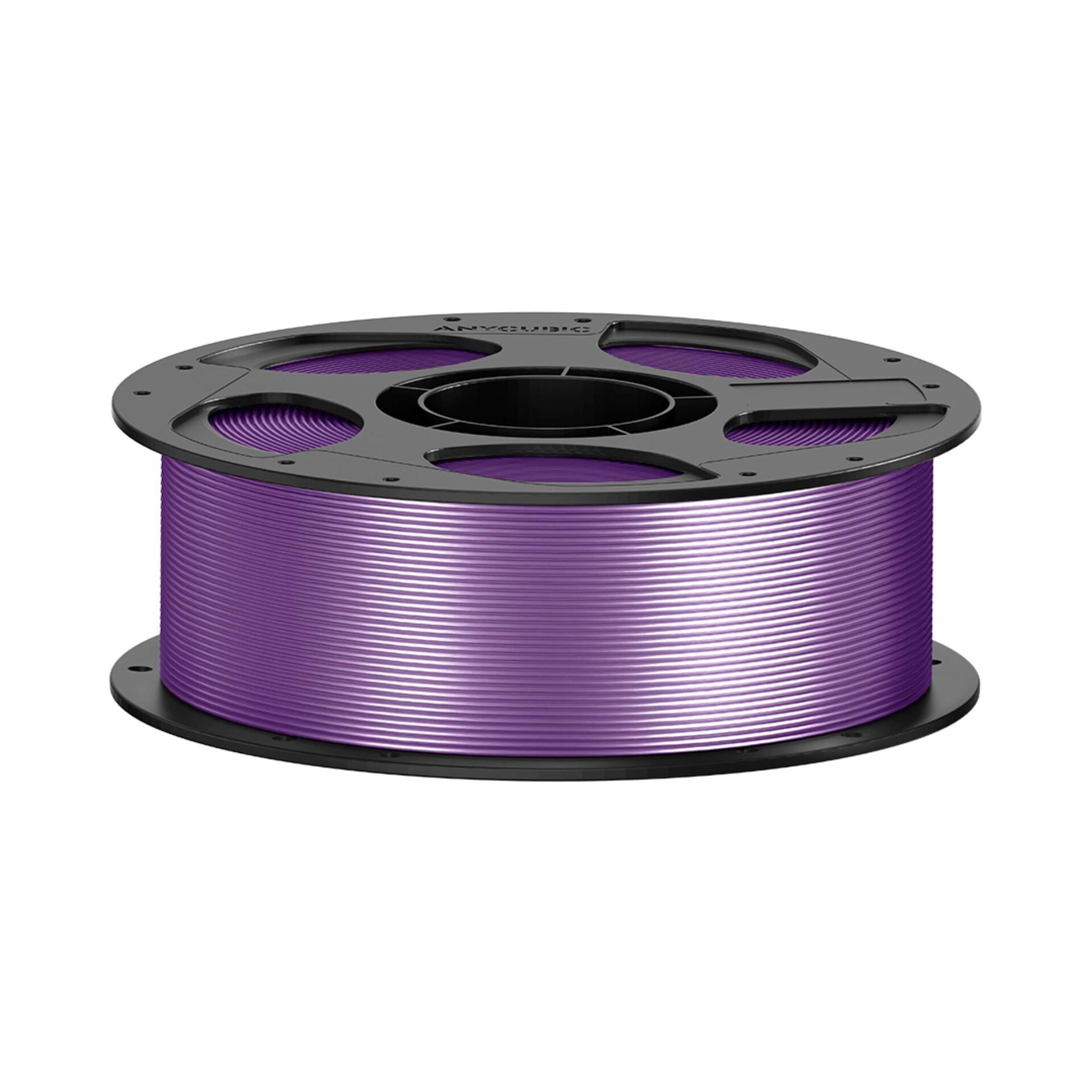 Eine schwarze Spule gefüllt mit glänzendem violettem 3D-Druckerfilament auf weißem Hintergrund.