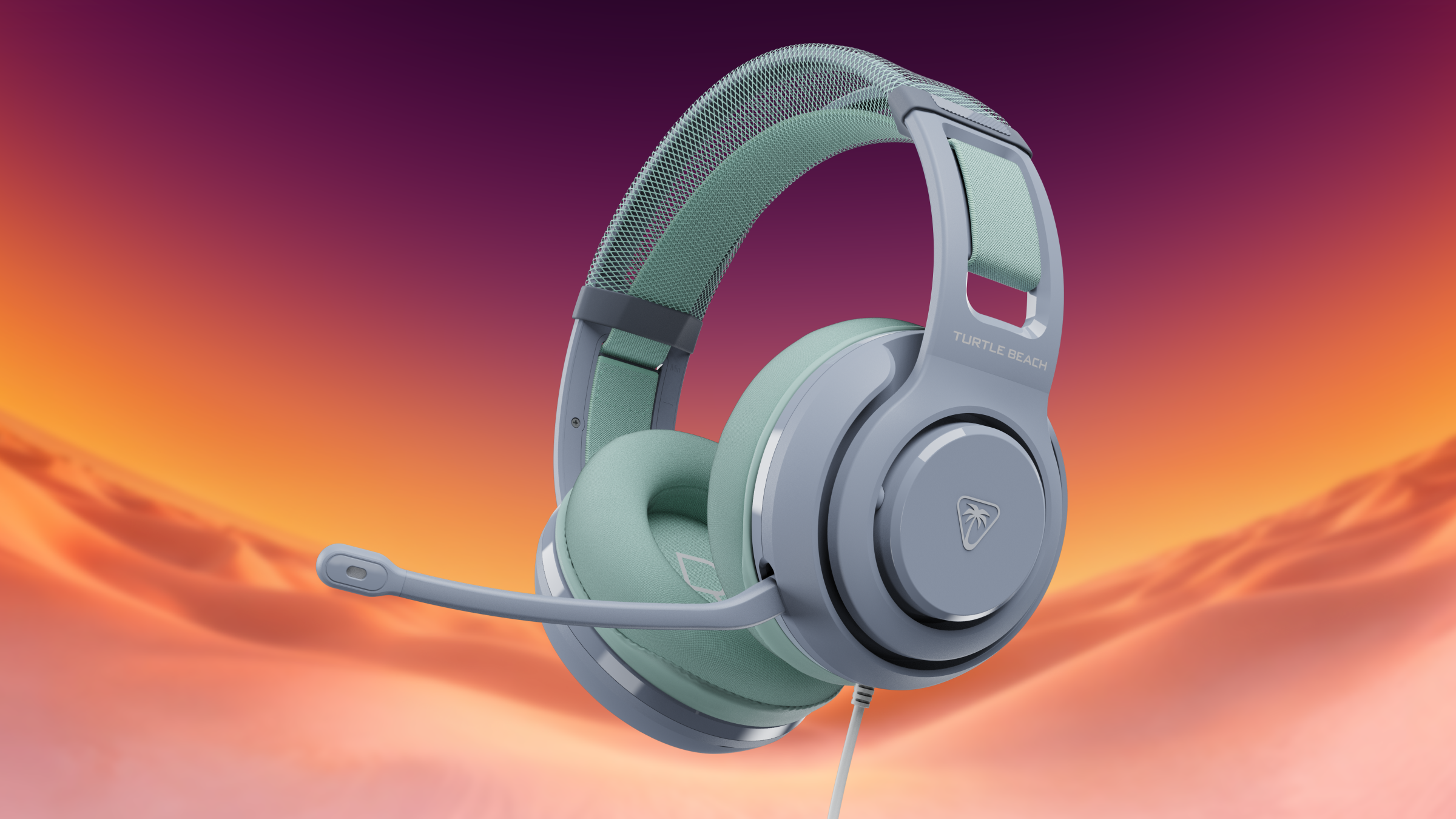 Light blue Turtle Beach gaming headset with microphone against an orange desert background.