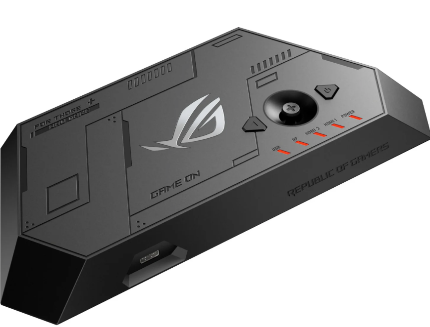 Ein schwarzes ASUS ROG-Gerät mit Logo, Joystick und LEDs für USB, DP und HDMI vor weißem Hintergrund.