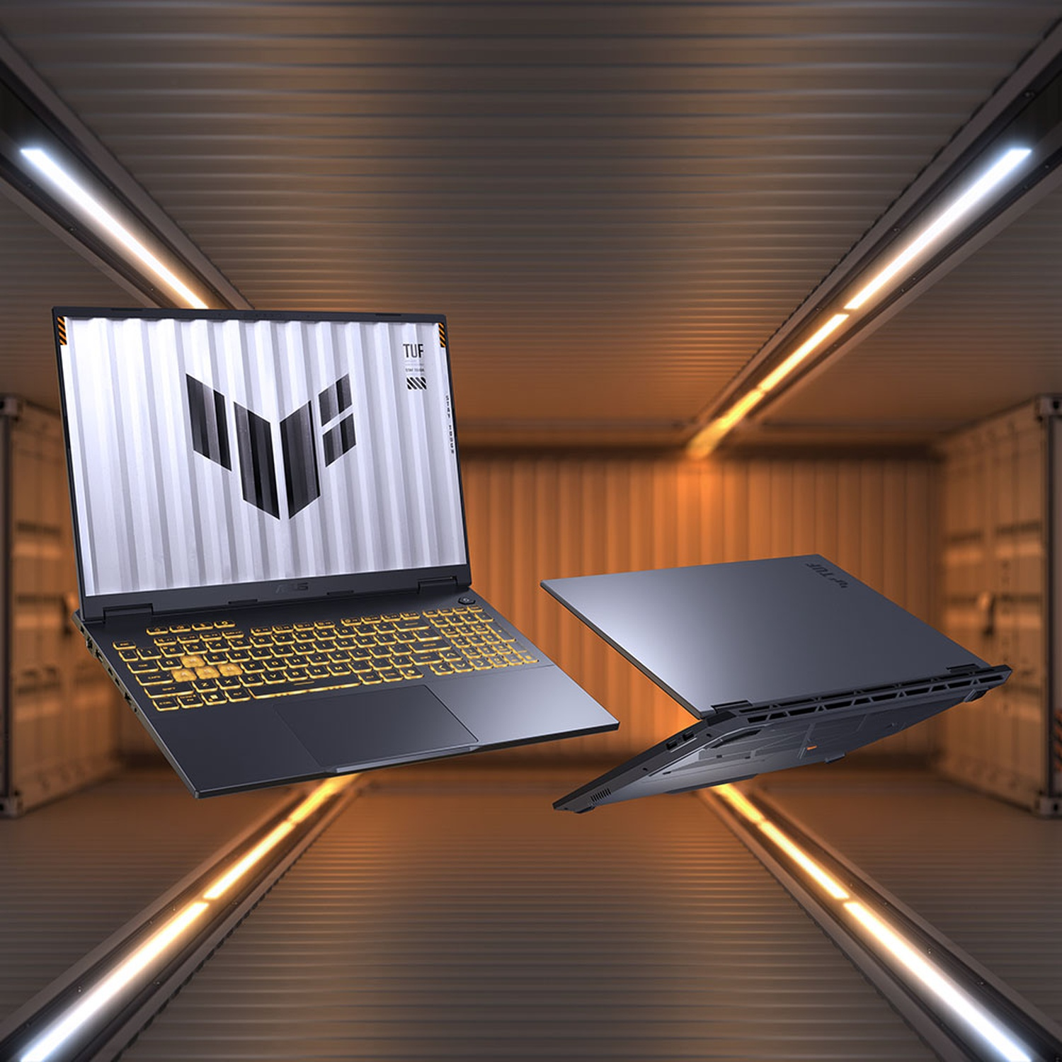 Twee ASUS TUF gaming-laptops zweven in een futuristische, verlichte gang met metalen muren.