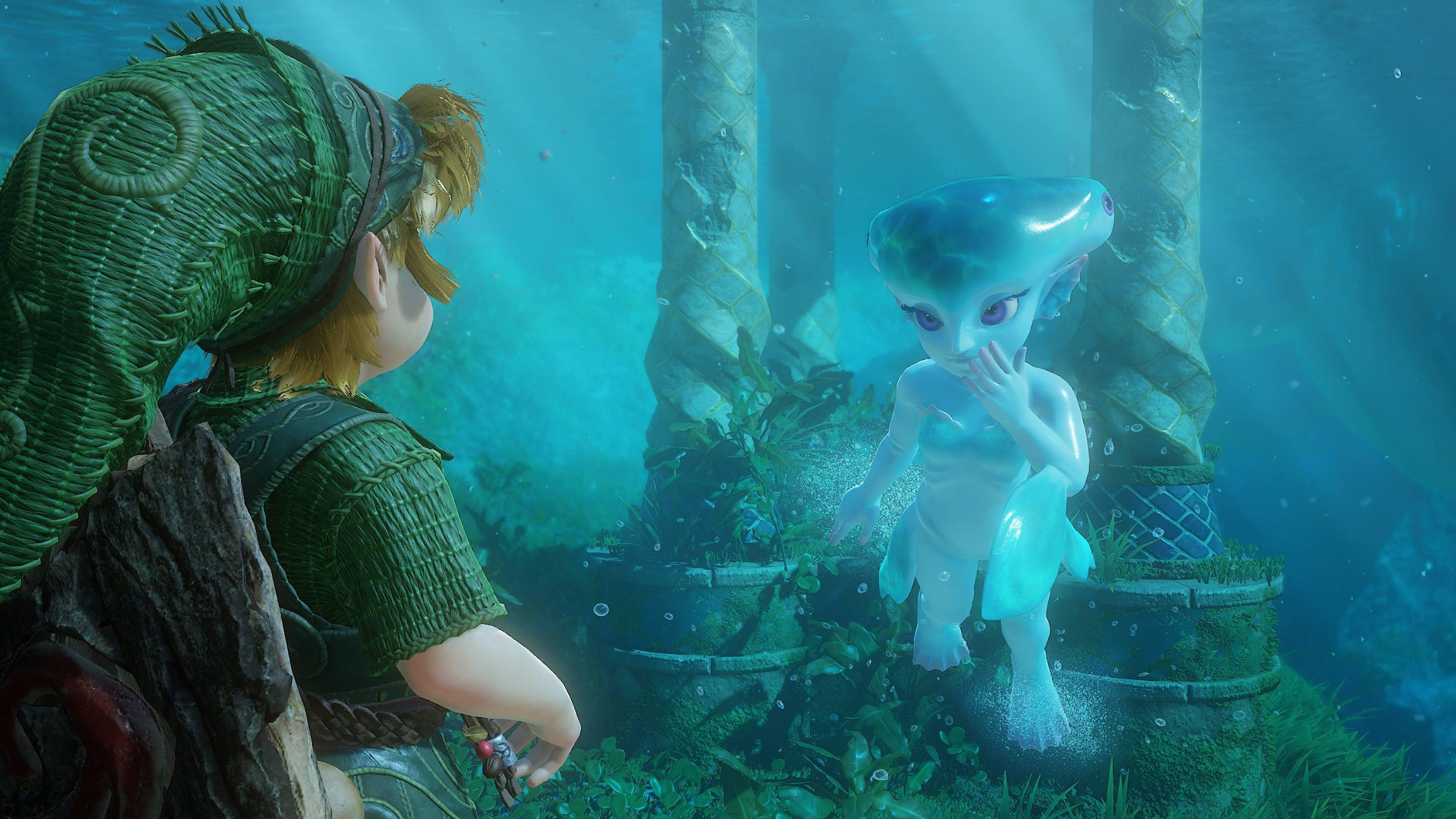 Link steht unter Wasser vor einer blau leuchtenden, fischähnlichen Kreatur zwischen alten Säulen.
