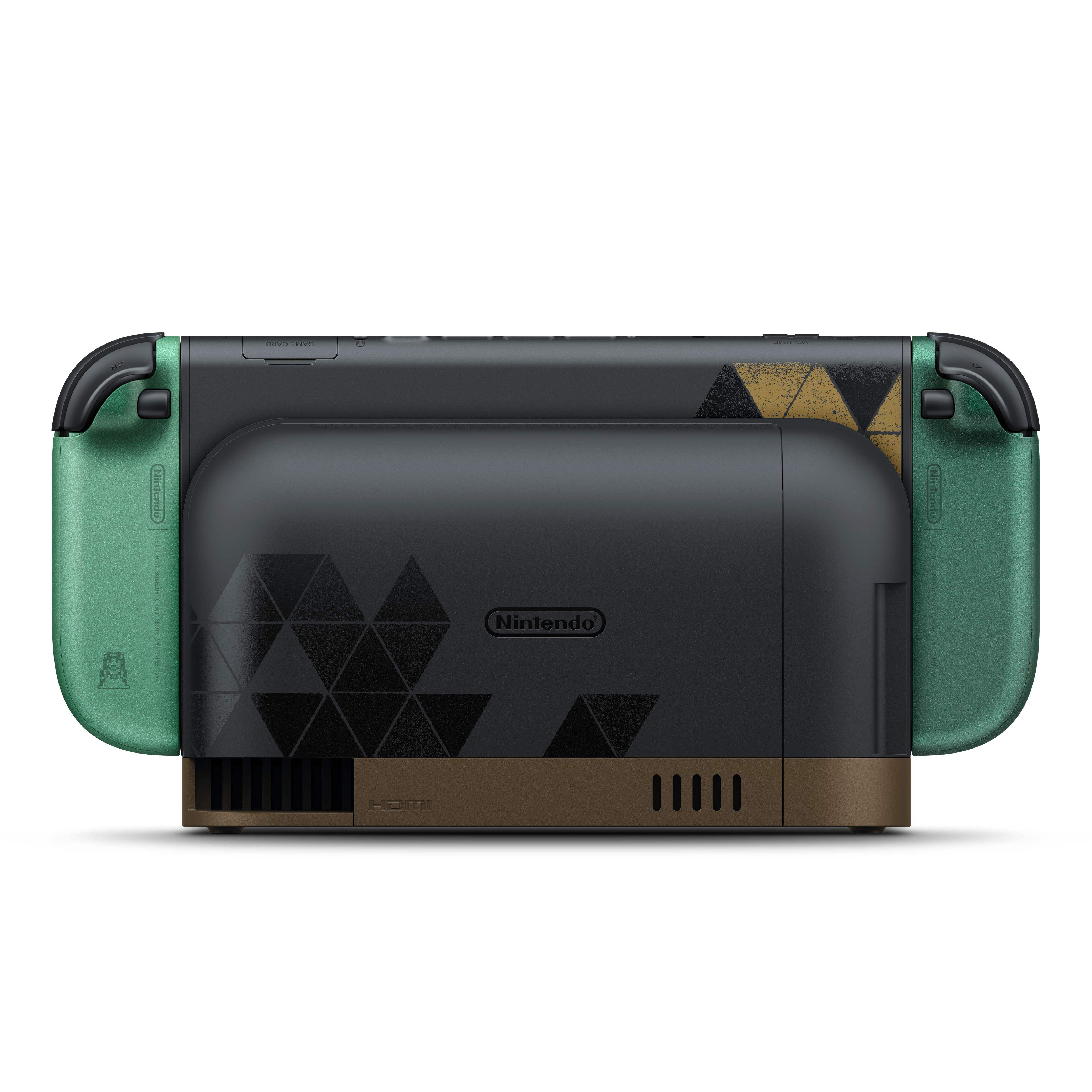 Eine schwarze Nintendo Switch in einer passenden Ladestation mit grünem Joy-Con-Controller und Dreiecksmustern.