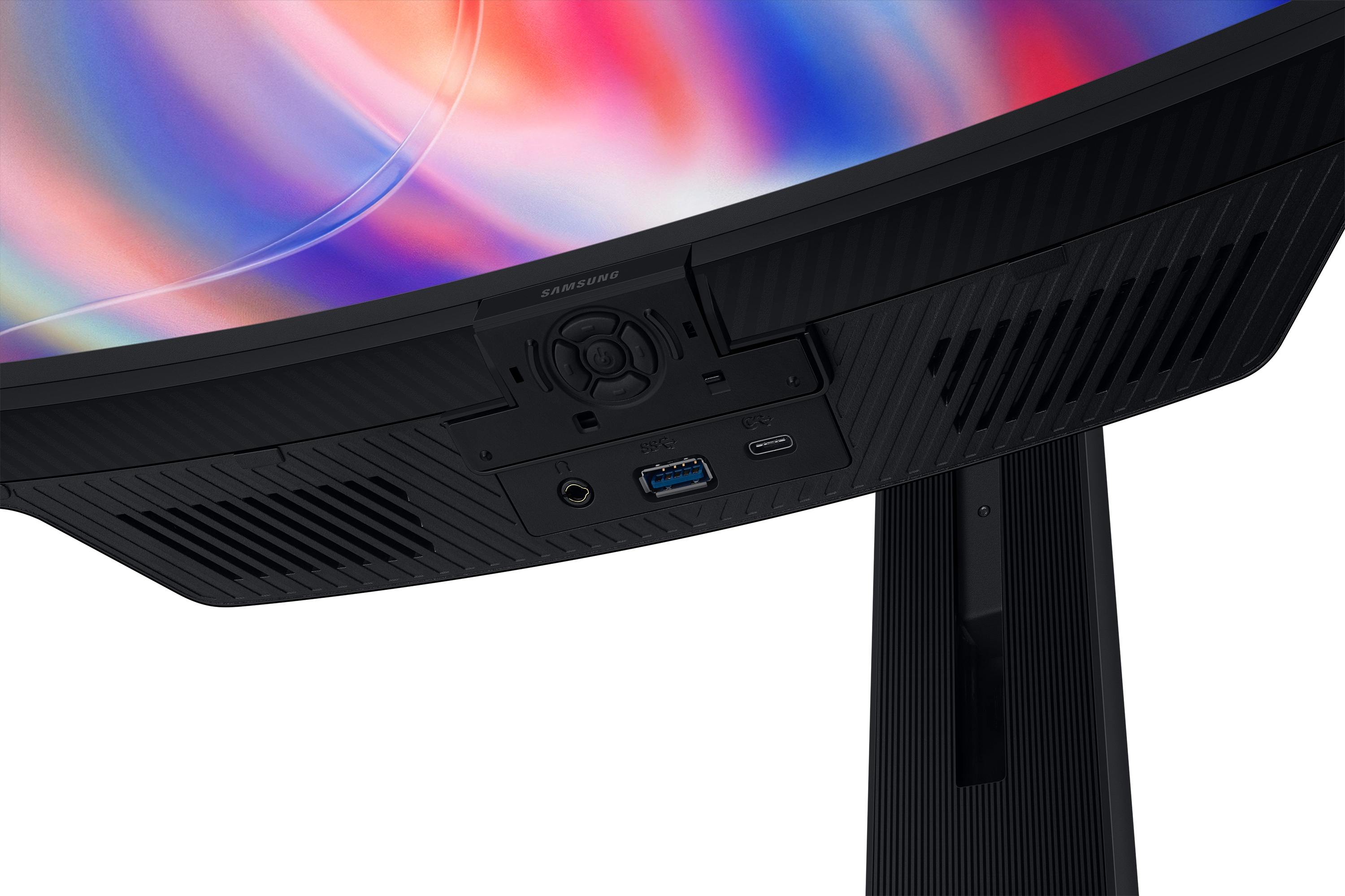 Widok od dołu zakrzywionego monitora Samsung z portami i przyciskiem.