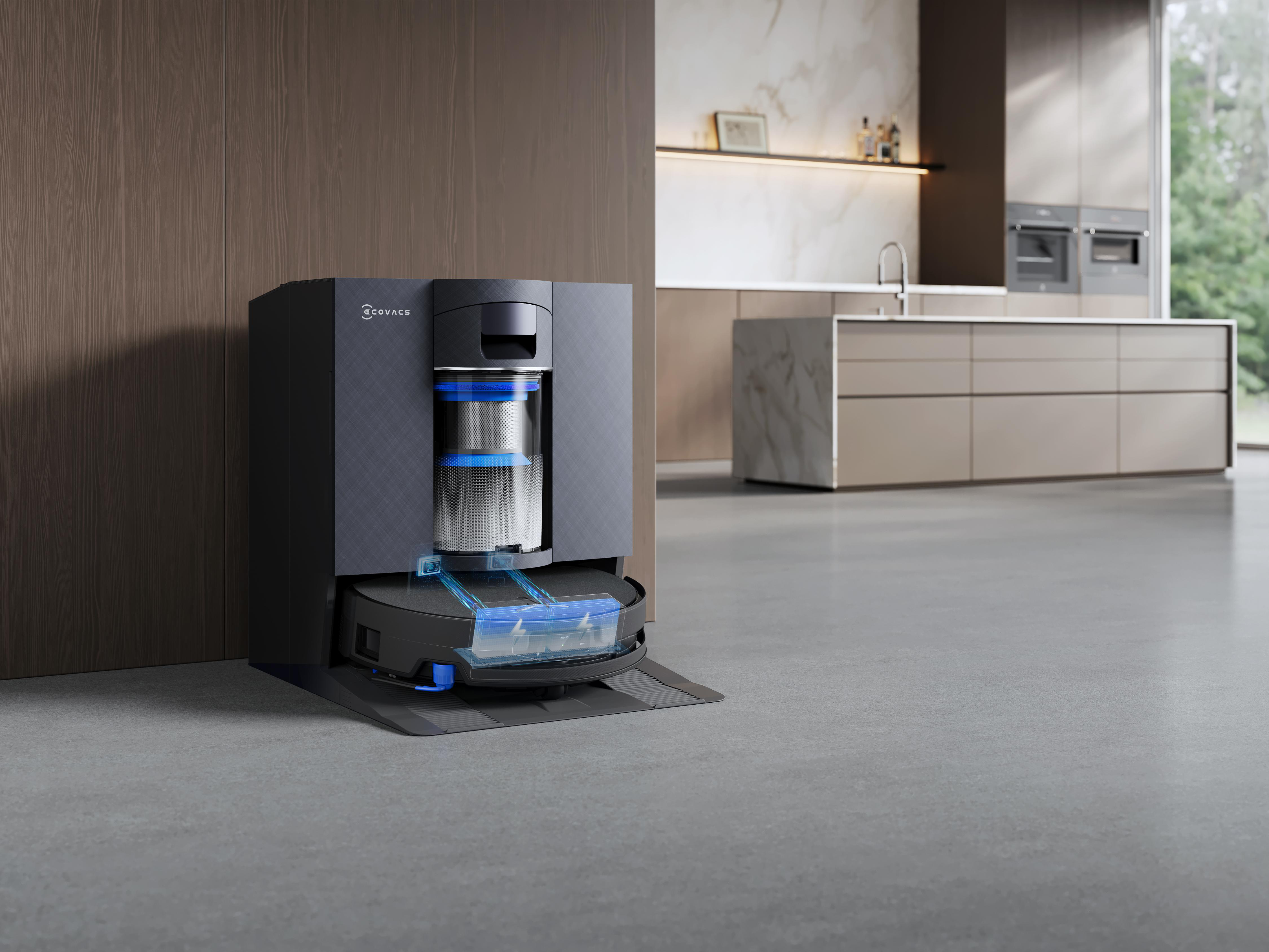 Eine schwarze Ecovacs-Roboterstaubsaugerstation mit blauen Lichteffekten in einer modernen Küche.