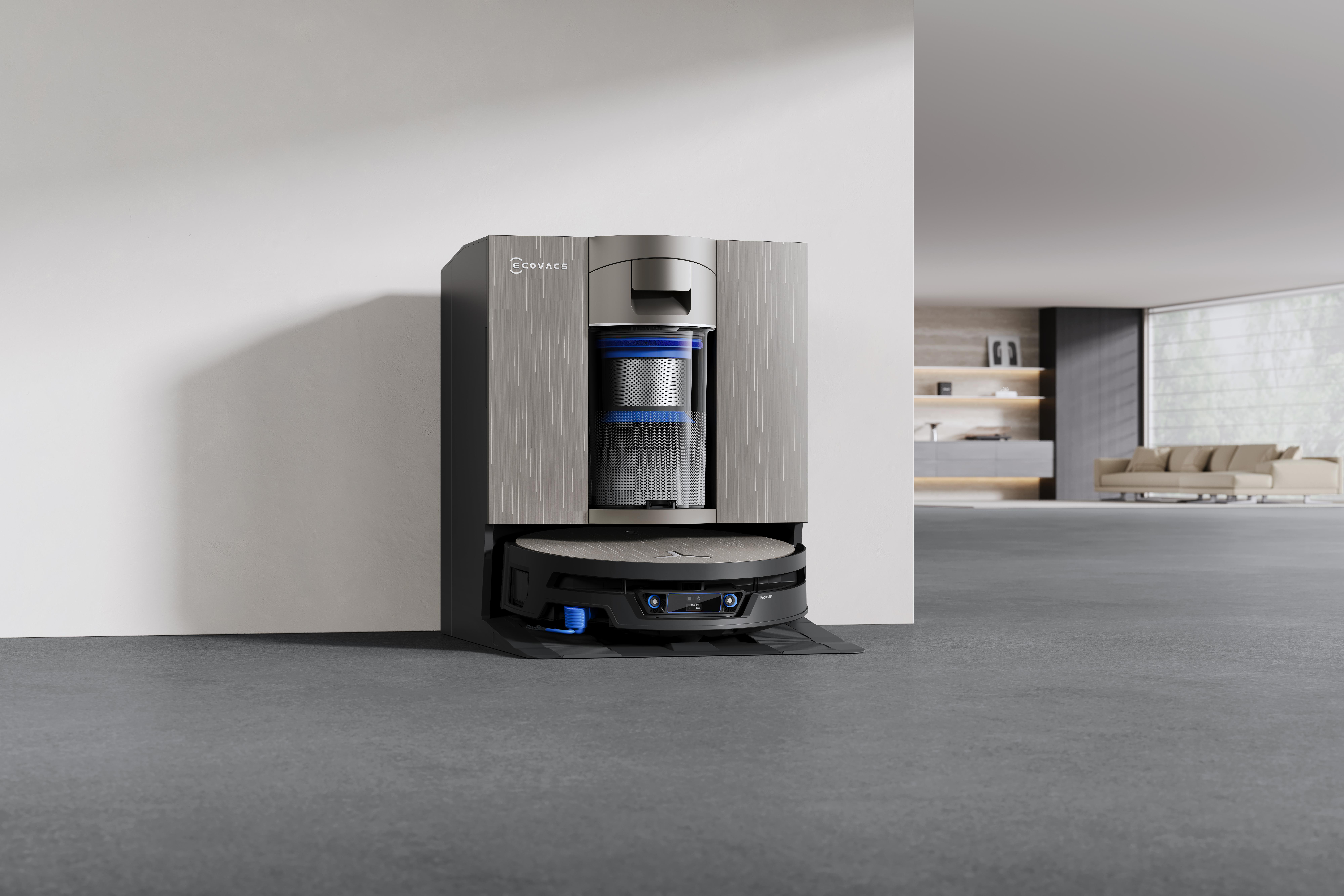 Eine Ecovacs-Roboterstaubsaugerstation steht in einem modernen, minimalistischen Raum auf grauem Boden.