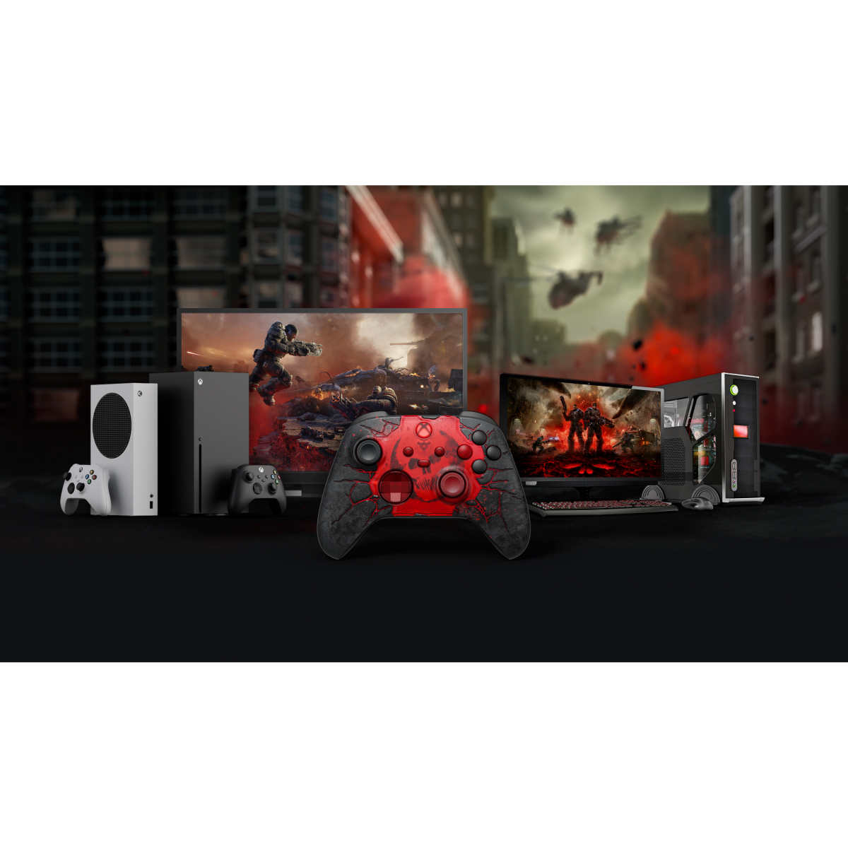 Las consolas, mandos y monitores Xbox muestran videojuegos con un fondo de ciudad destruida.