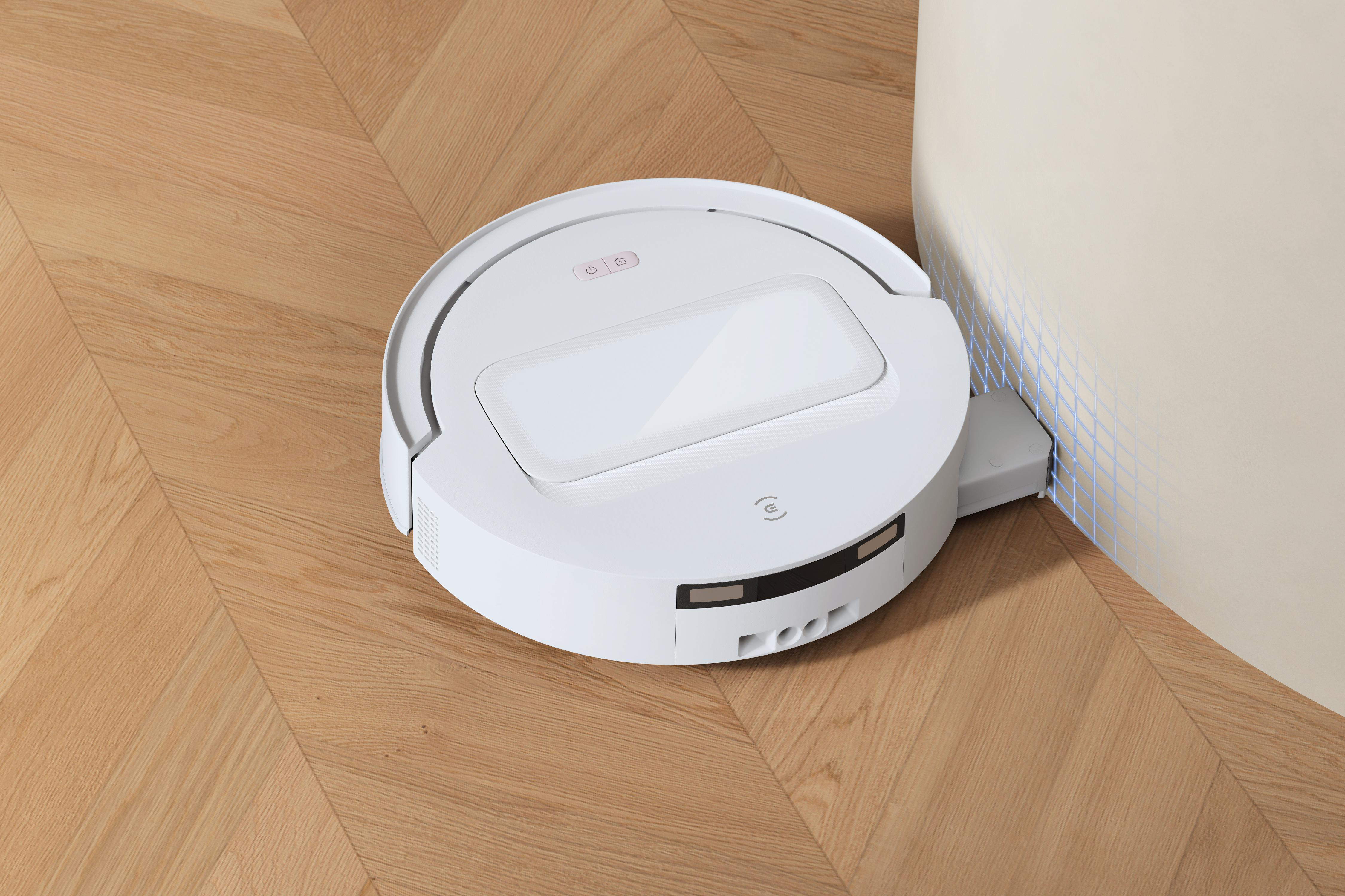 Ein weißer Saugroboter steht auf einem hellen Holzboden an einer Wand mit blauen Rasterlinien.