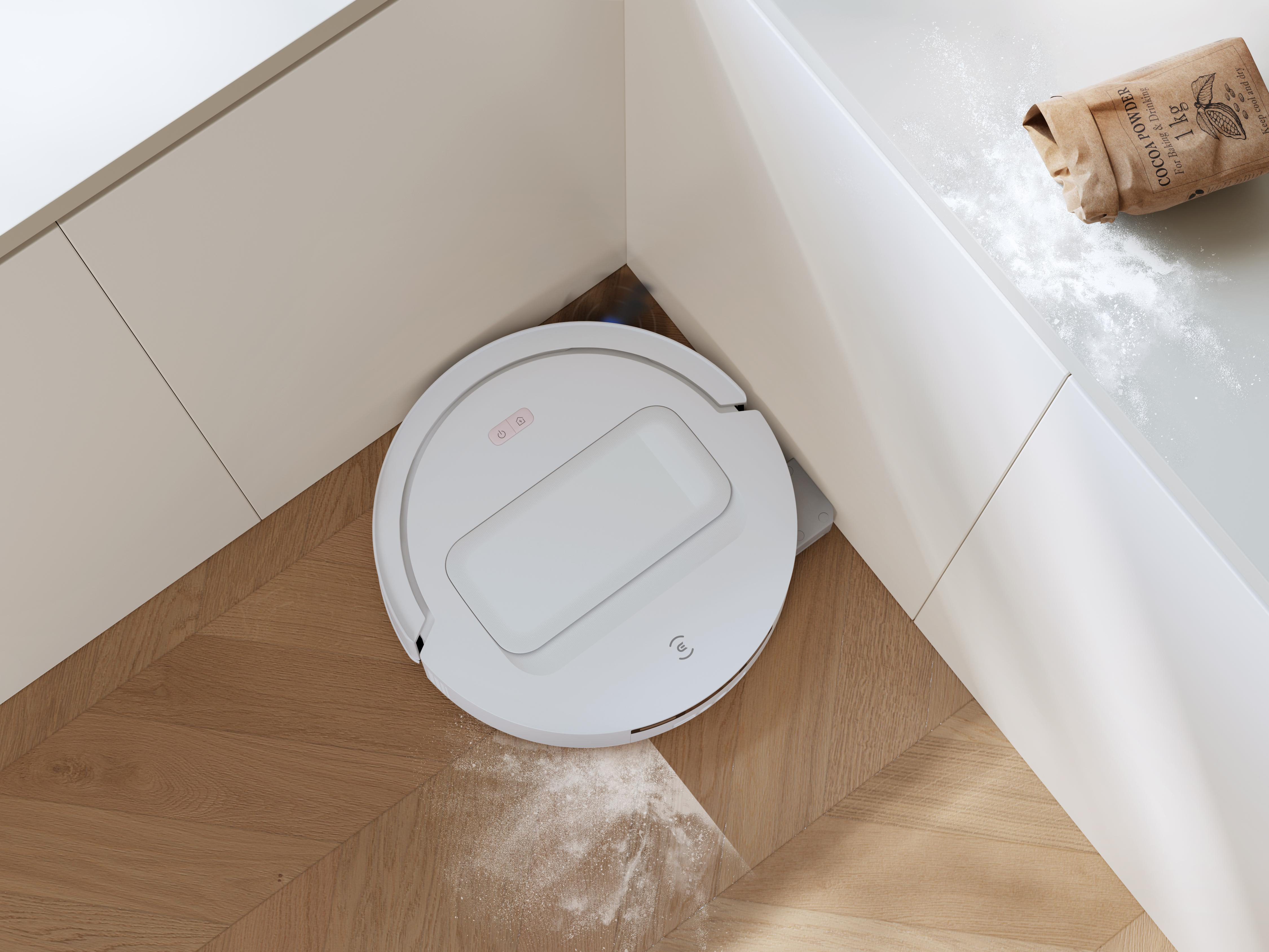Ein weißer Saugroboter reinigt weißen Staub auf einem Holzparkettboden in einer Ecke.