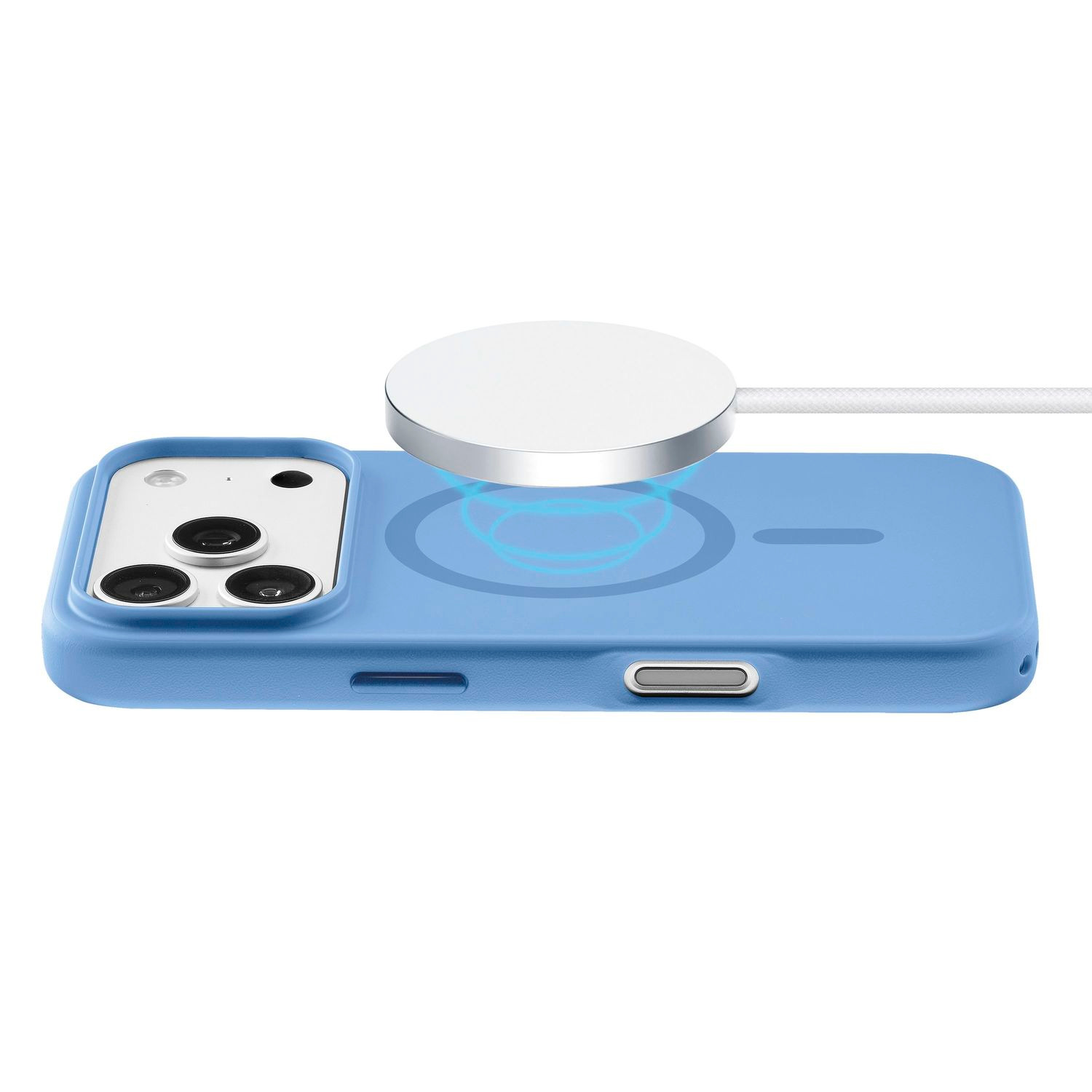 Un smartphone azul se carga de forma inalámbrica con un cargador magnético redondo y blanco sobre fondo blanco.
