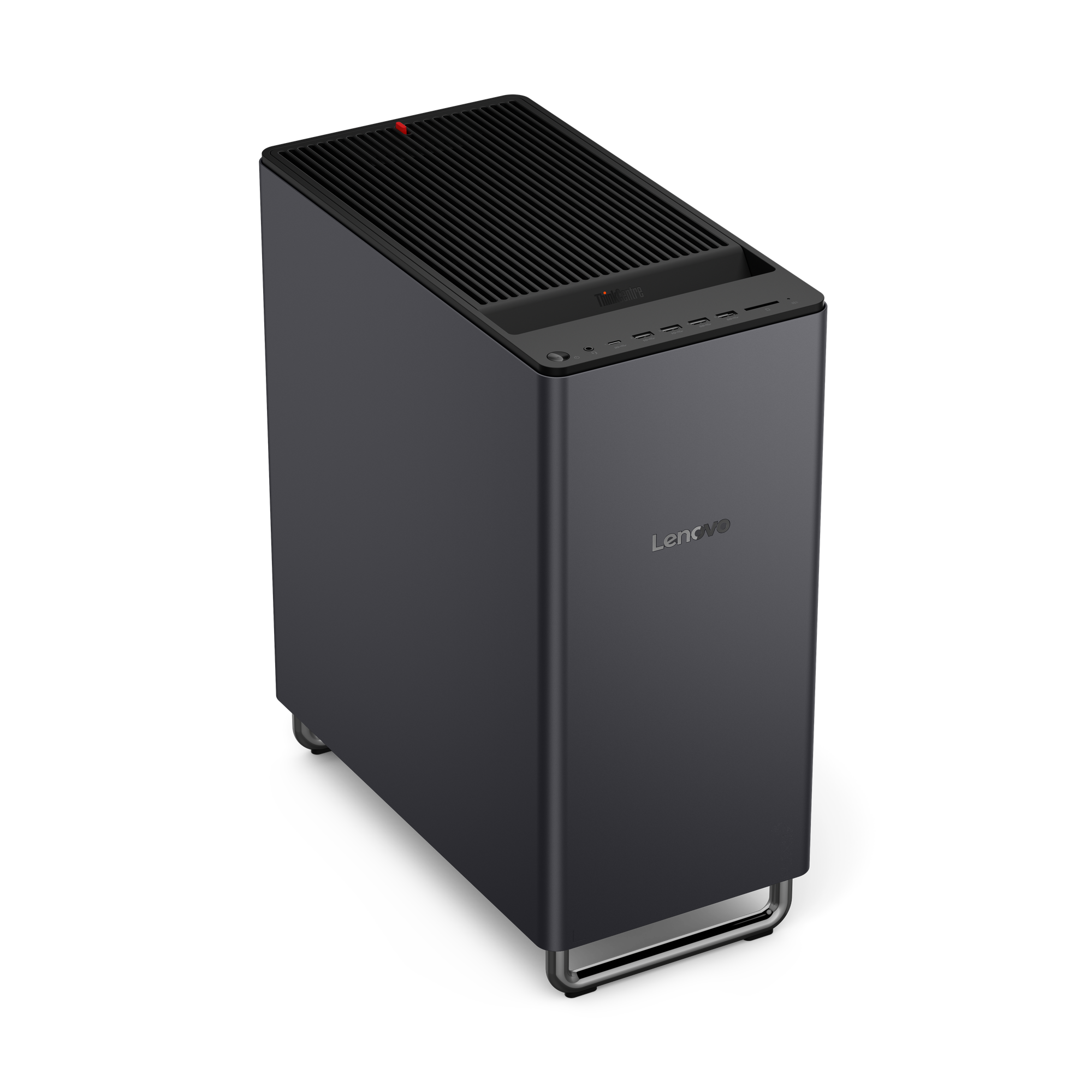 Ein grauer Lenovo Desktop-PC mit gerippter Oberseite und Frontanschlüssen steht auf einem schwarzen Hintergrund.