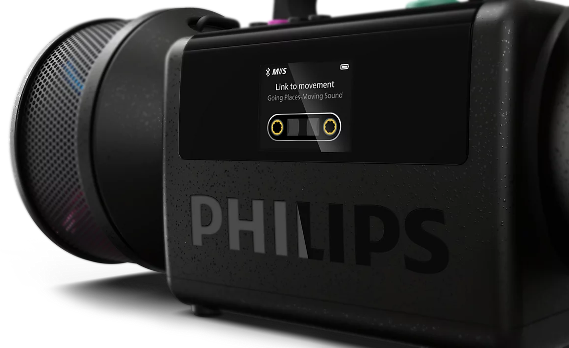 Fekete Philips boombox digitális kazetta kijelzővel és hangszóróval sötét háttér előtt.