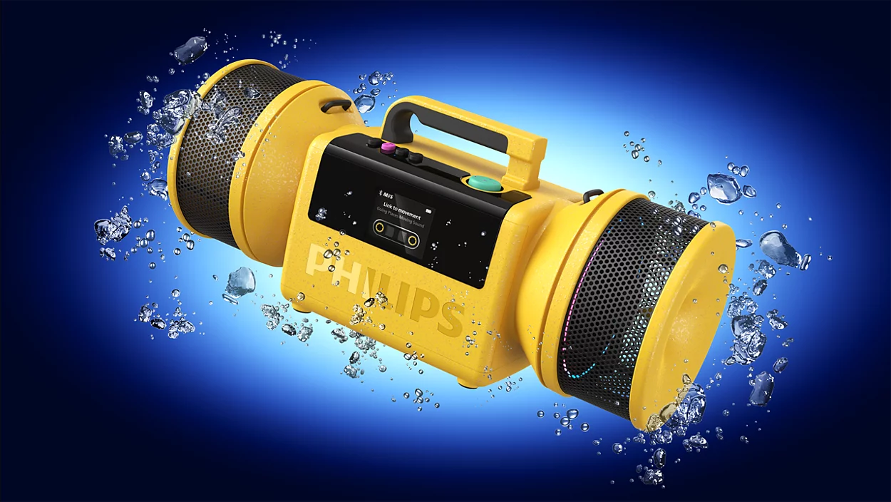 Sárga hordozható Philips hangszóró fekete rácsokkal, vízcseppekkel körülvéve kék háttér előtt.