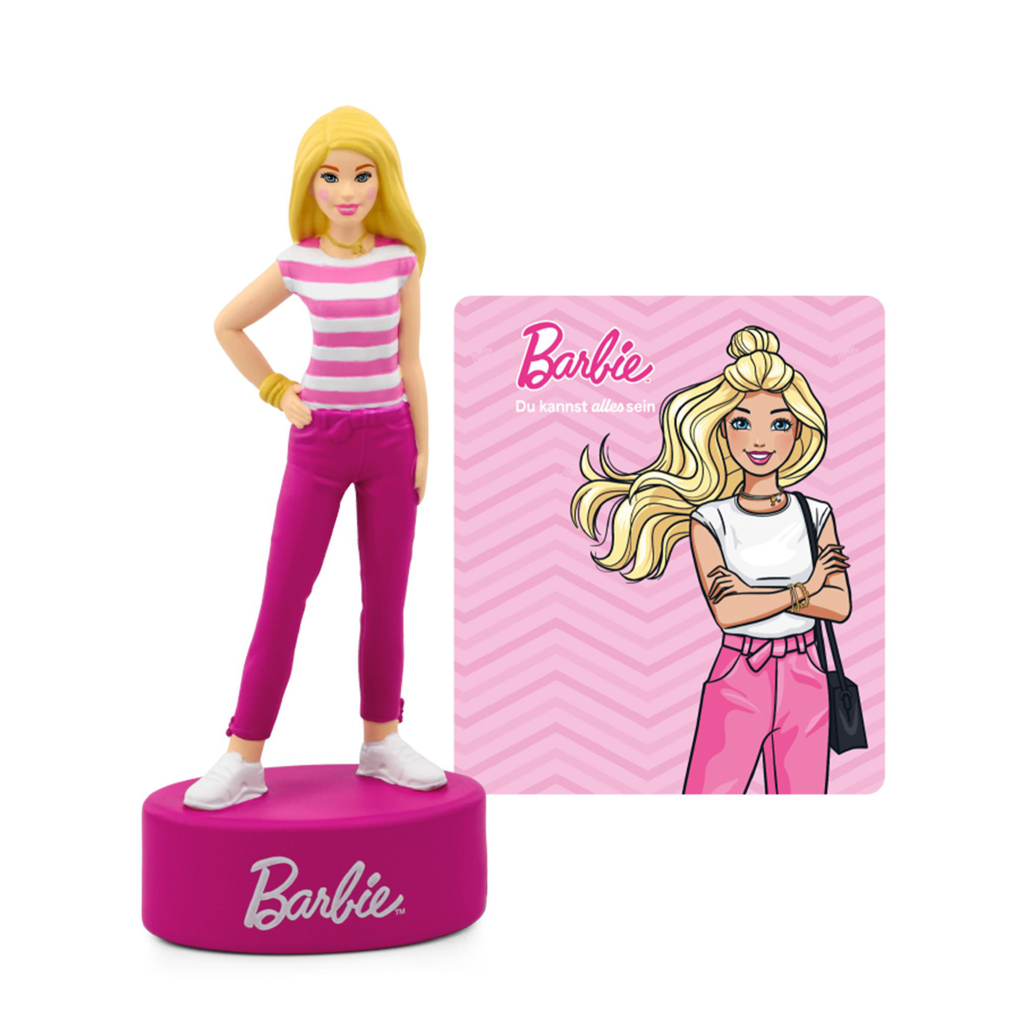 Eine Barbie-Figur mit blonden Haaren, pink gestreiftem Shirt und pinker Hose auf pinkem Sockel.