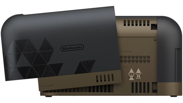 Czarno-złote urządzenie Nintendo z grafiką pikselową i logo Nintendo z boku.