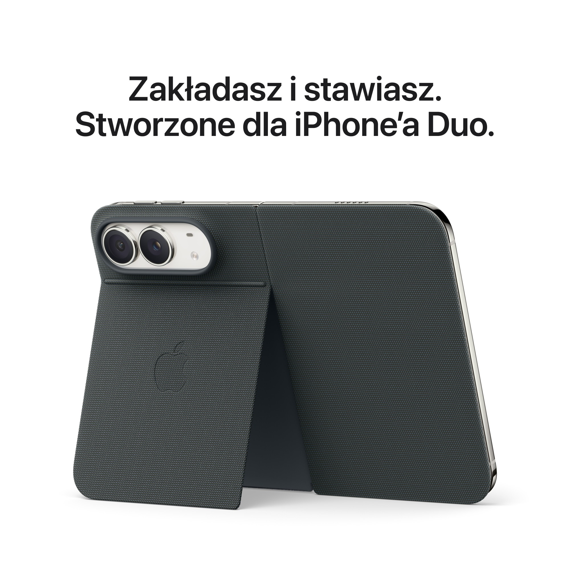 Smartfon w ciemnoszarym etui ochronnym z zintegrowaną podstawką utrzymującą go w pionie.