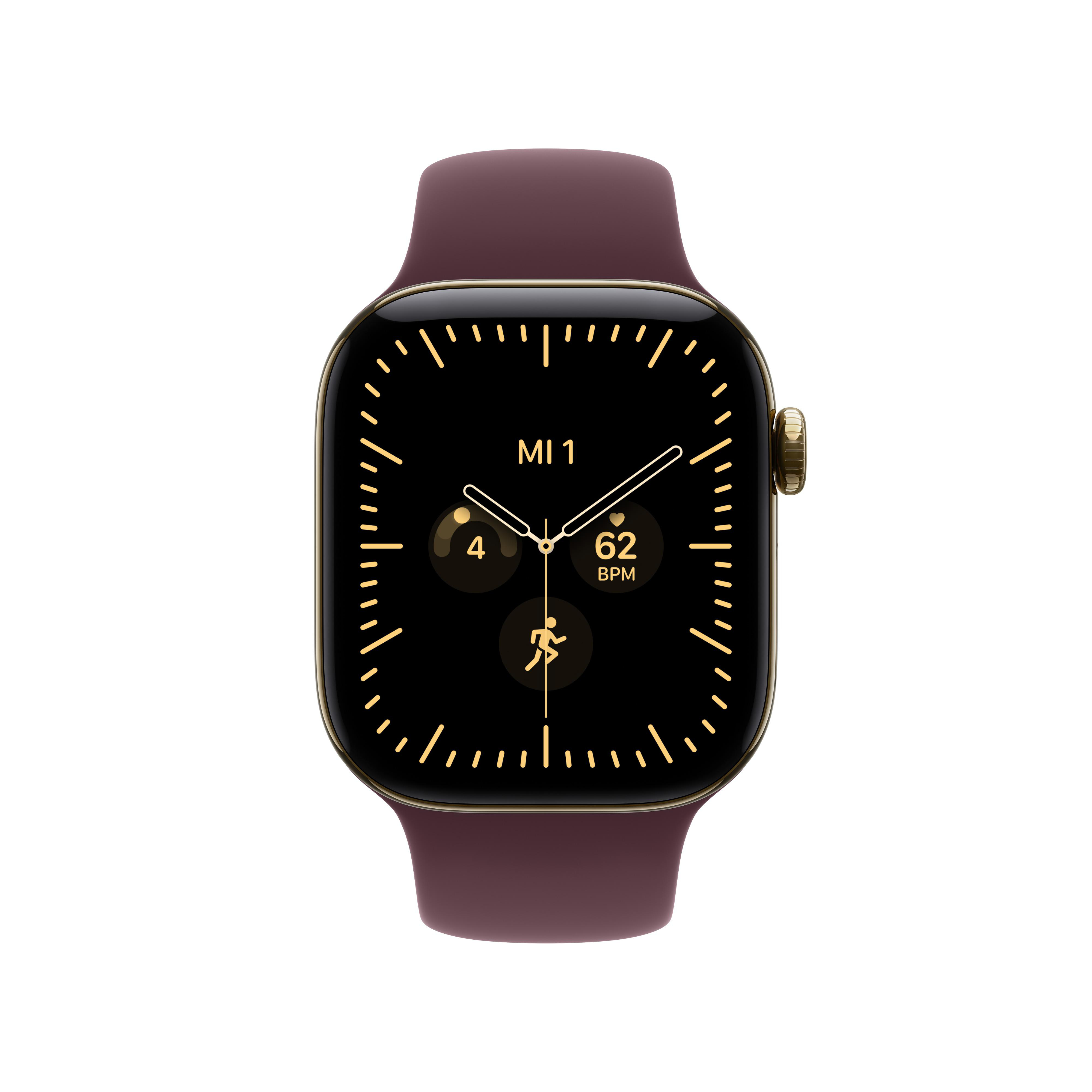 Eine Smartwatch mit dunklem Silikonarmband und goldenem Gehäuse zeigt ein schwarzes Zifferblatt mit goldenen Details.