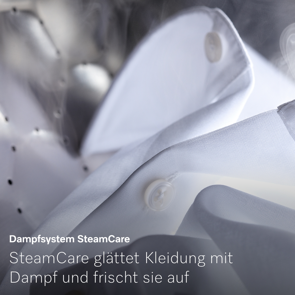 Weißes Hemd im Trockner mit Dampfpflege und deutschem Text.