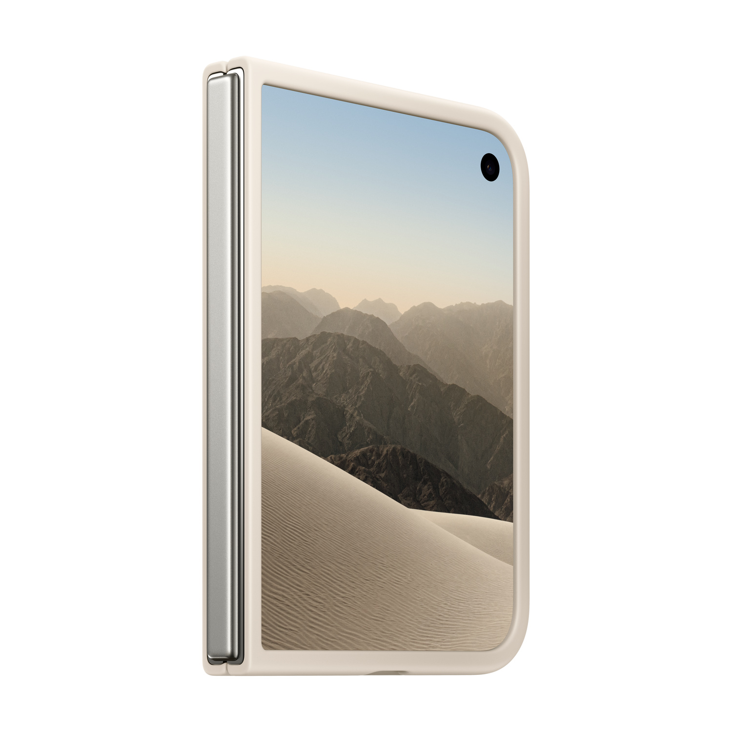 Uno smartphone pieghevole beige con uno sfondo di montagne e dune desertiche sullo schermo esterno chiuso.