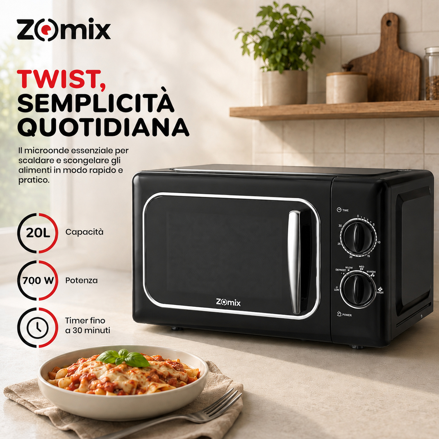 Microonde nero Zomix con dettagli cromati e manopole, posizionato sul piano cucina con un piatto di pasta.