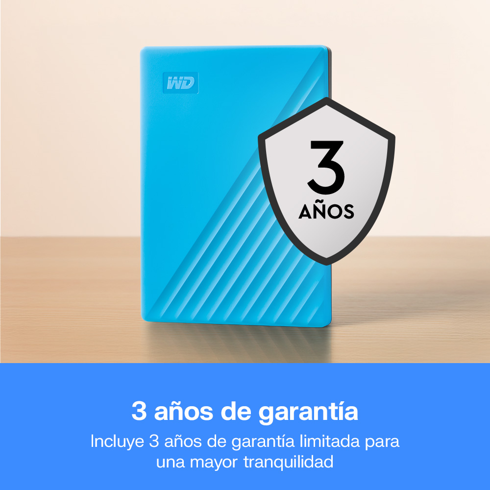 Disco duro externo WD azul brillante sobre superficie de madera con insignia de 3 años.
