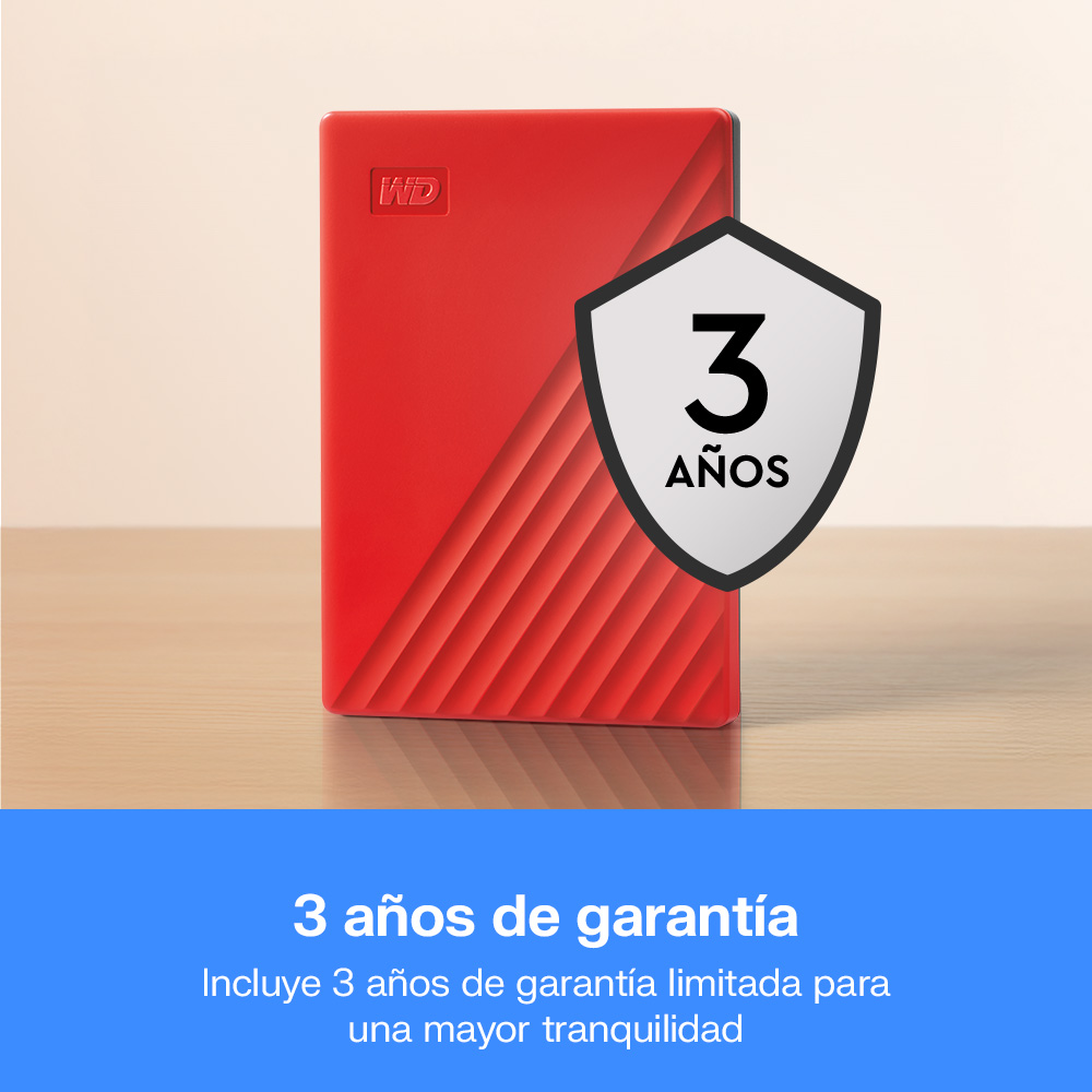 Un disco duro externo WD rojo sobre superficie de madera con icono de 3 años de garantía.