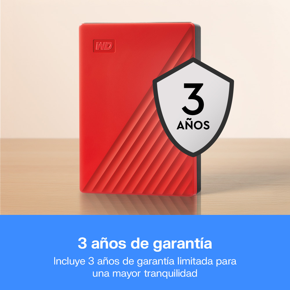 Disco duro WD rojo en mesa de madera con emblema de 3 años de garantía.