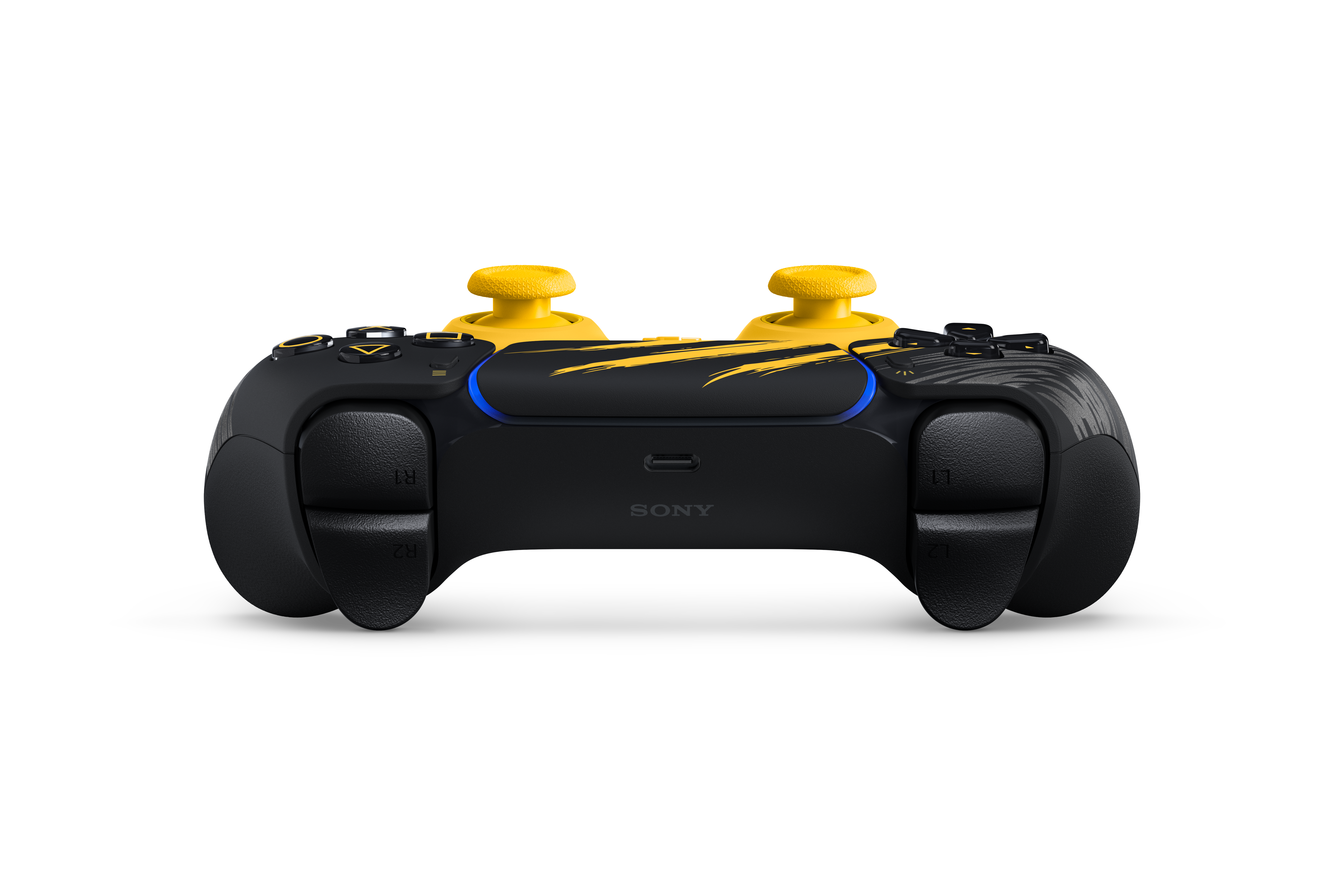 Siyah arka planda sarı detaylara ve dokulu analog kollara sahip siyah ve sarı bir Sony kontrol cihazı.