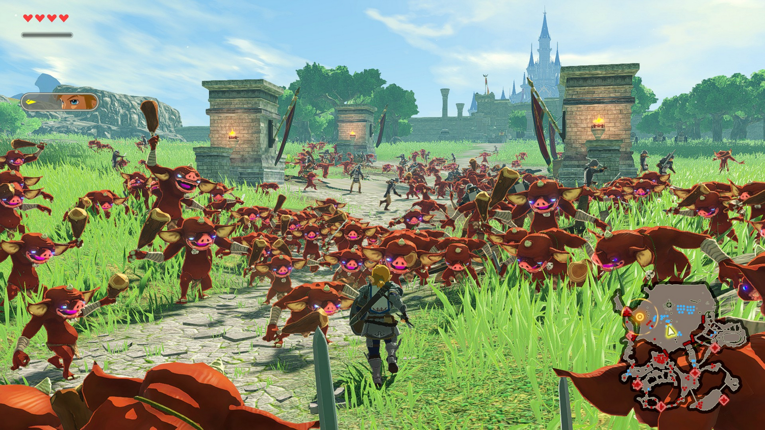 Link se enfrenta a una horda masiva de monstruos rojos en un campo con un castillo al fondo.