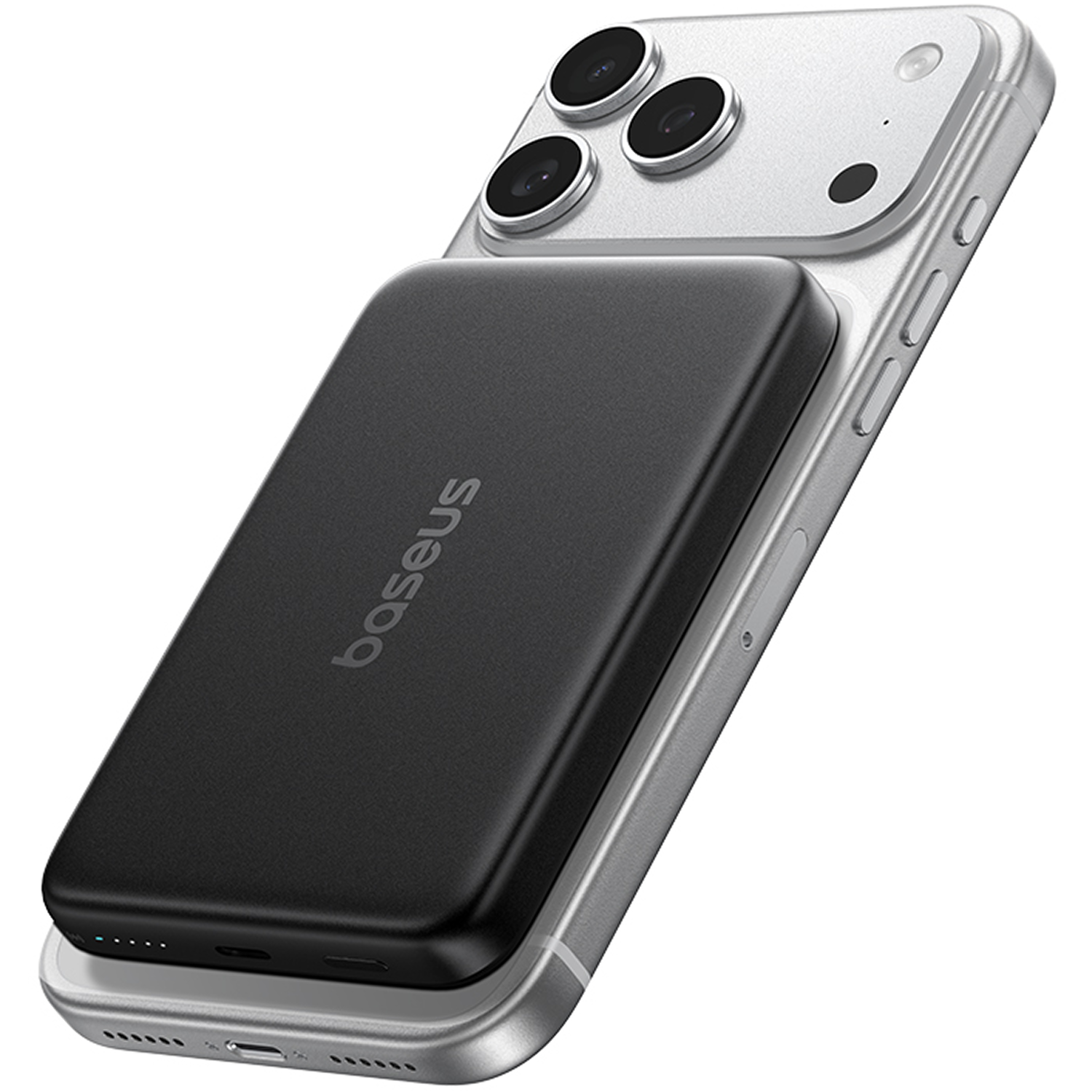 Una batería externa Baseus negra está adherida magnéticamente a la parte trasera de un smartphone plateado.