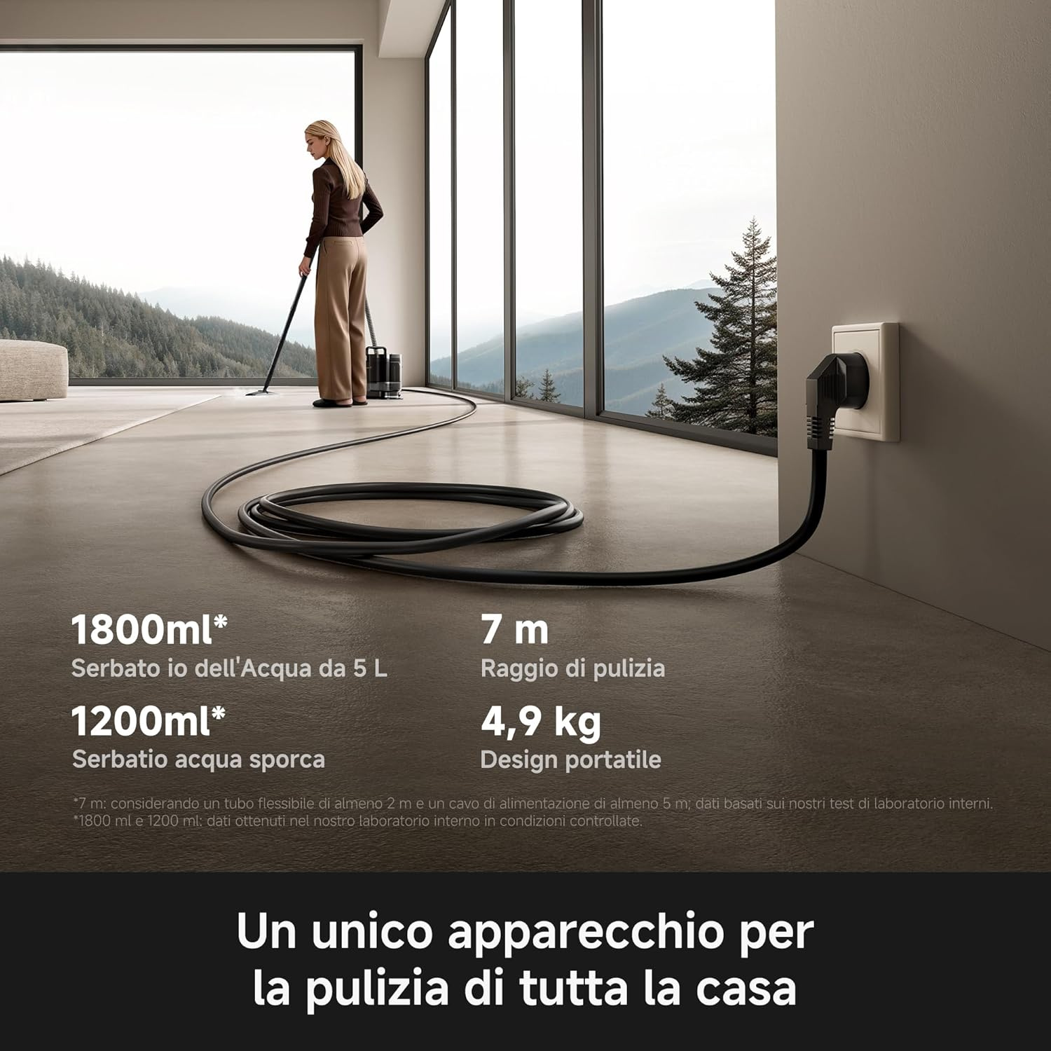 Una donna aspira in una stanza moderna con grandi finestre e montagne. Specifiche tecniche e presa elettrica sono visibili.