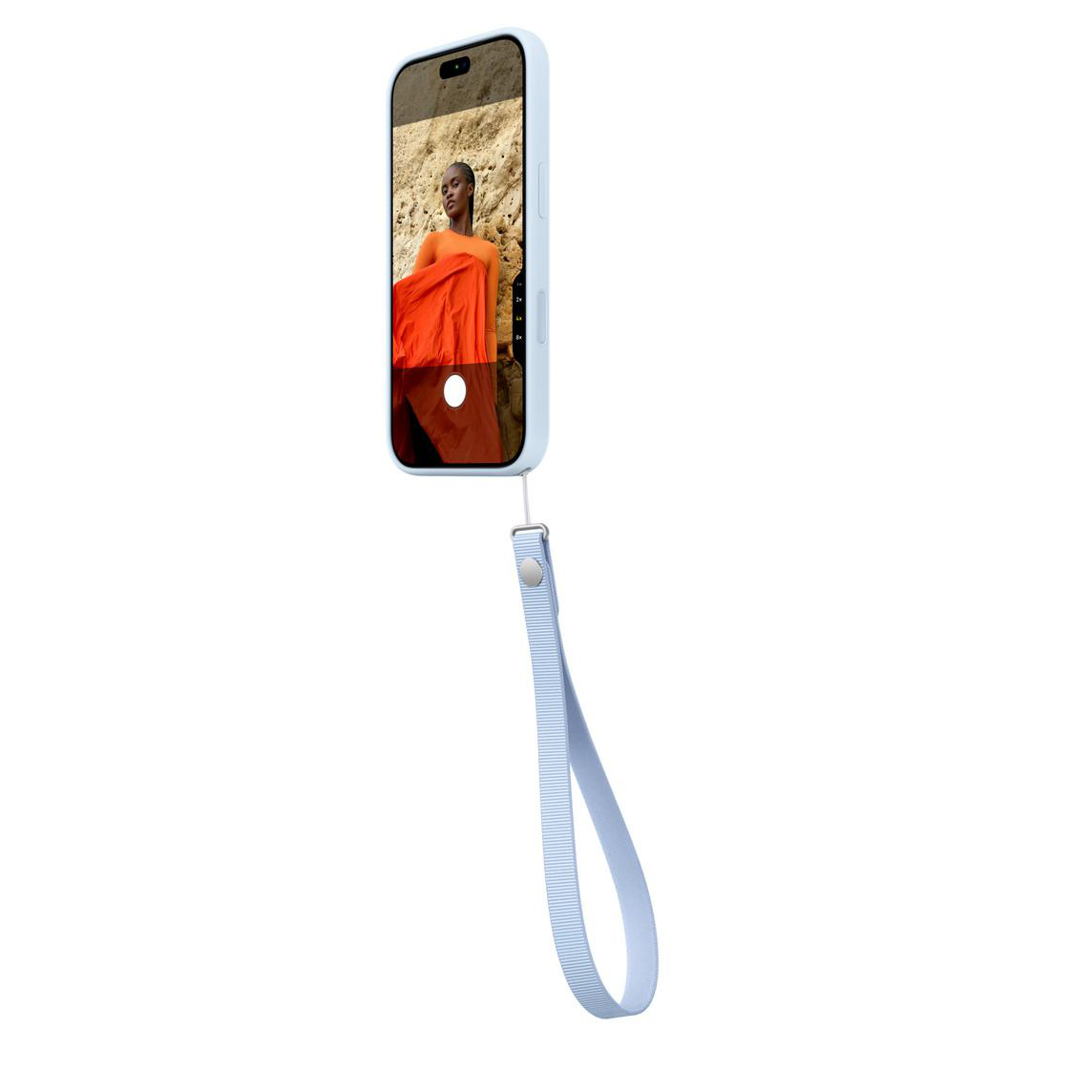 Ein hellblaues Smartphone mit einer angebrachten Handschlaufe zeigt ein Foto einer Frau in Orangetönen auf dem Display.