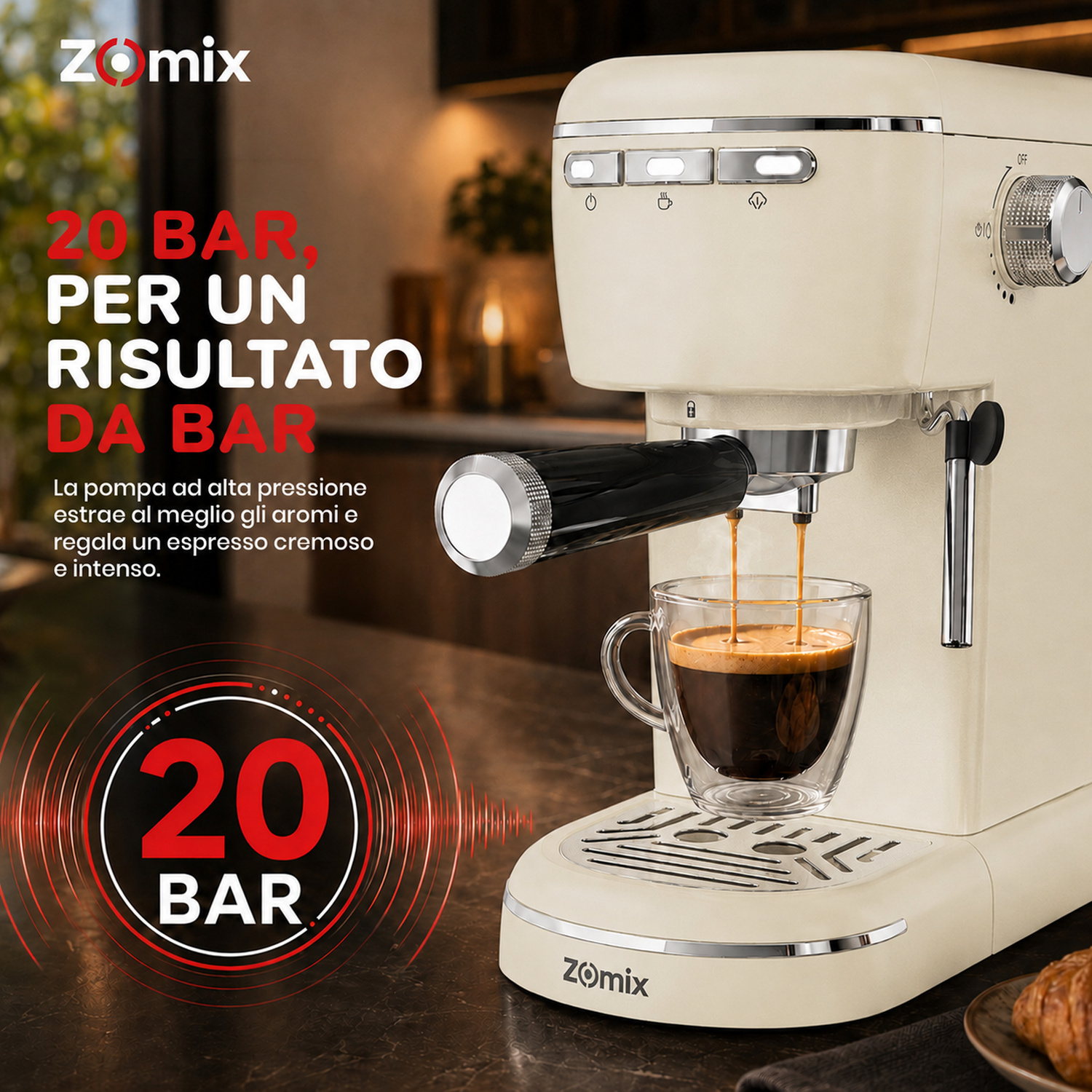 Una macchina da caffè Zomix color crema eroga caffè in una tazza di vetro su un tavolo.