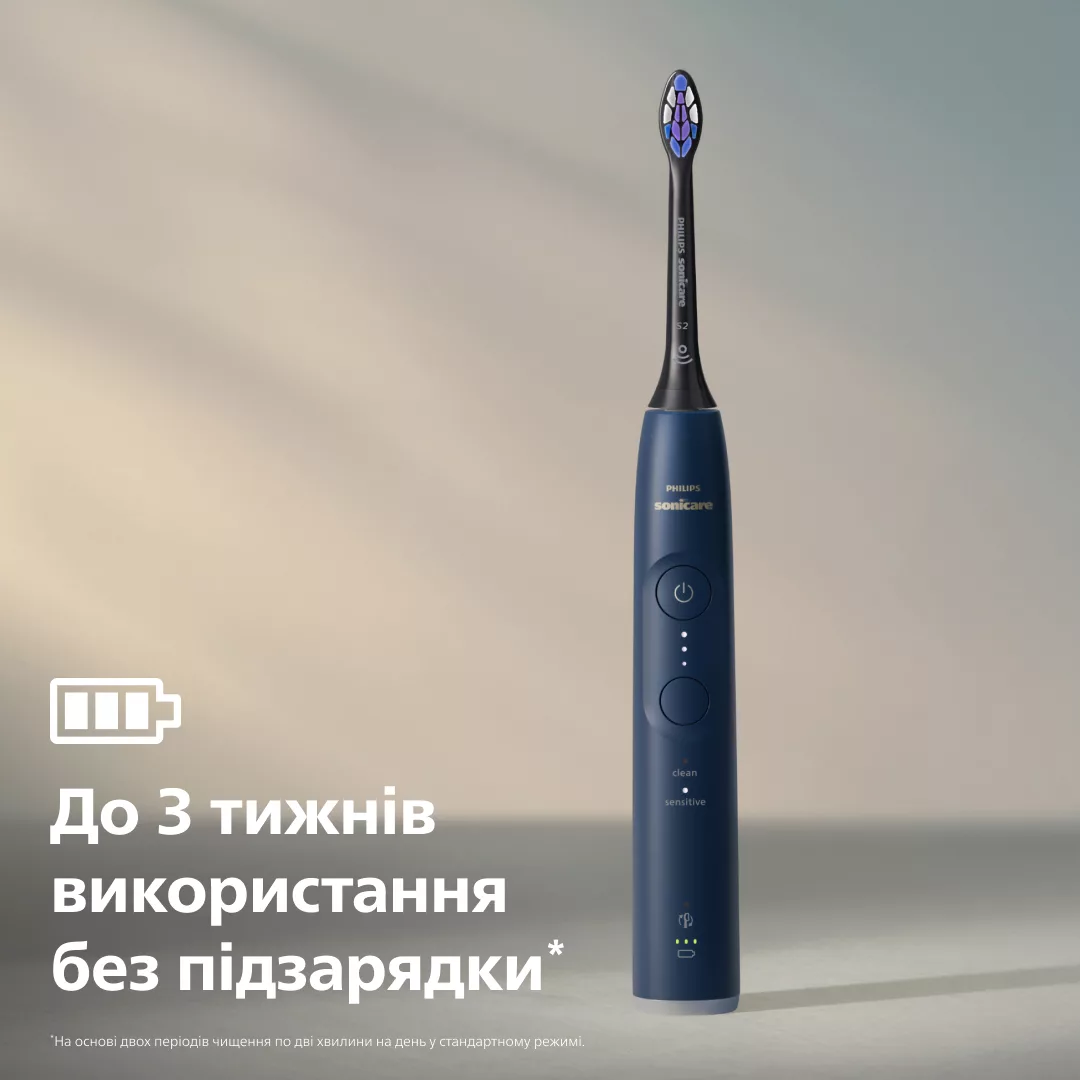 Eine dunkelblaue Philips Sonicare Zahnbürste auf neutralem Grund mit Text über Batterielaufzeit.