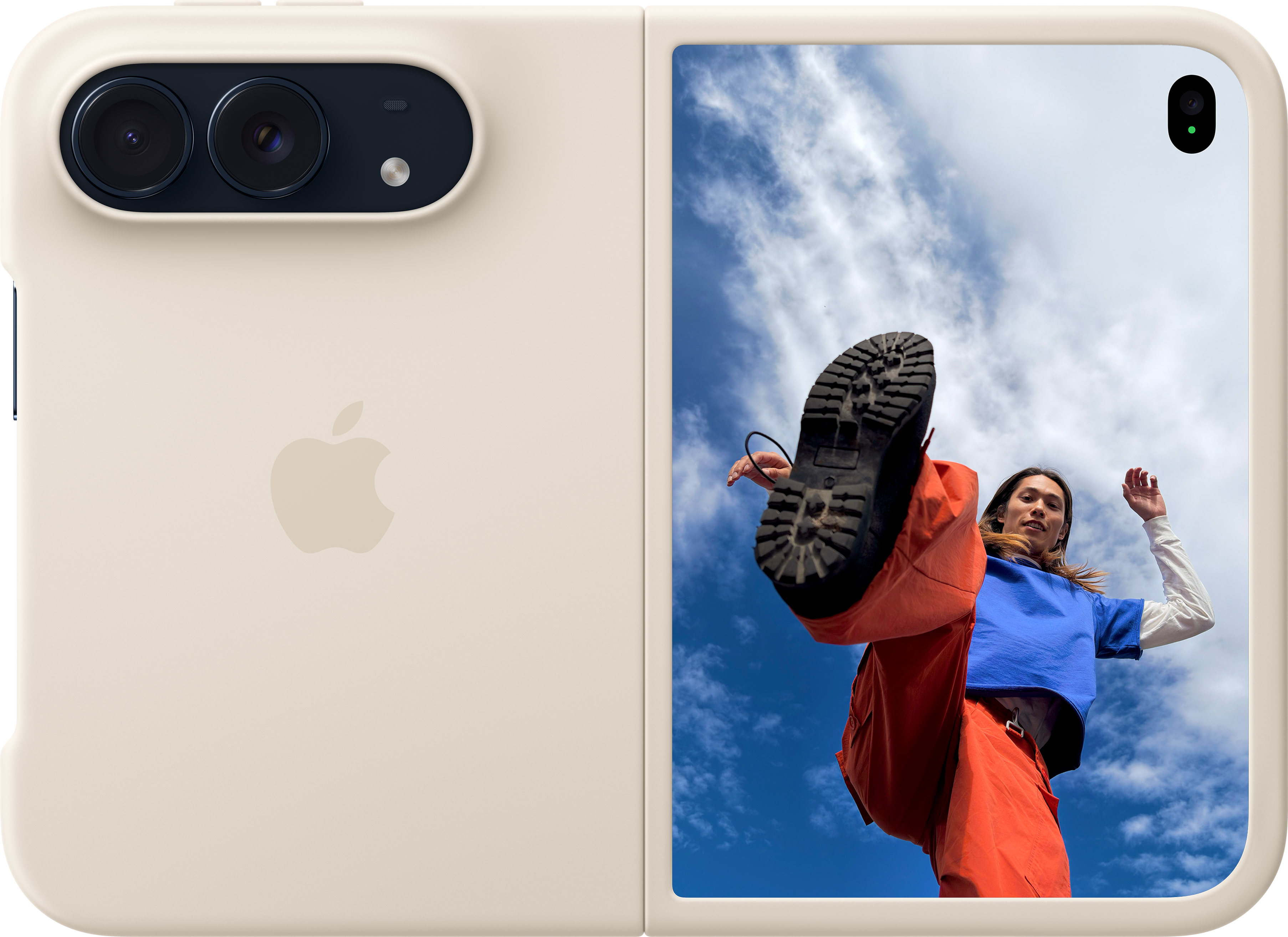 Un téléphone pliable de couleur crème affiche un homme donnant un coup de pied vers le ciel bleu.