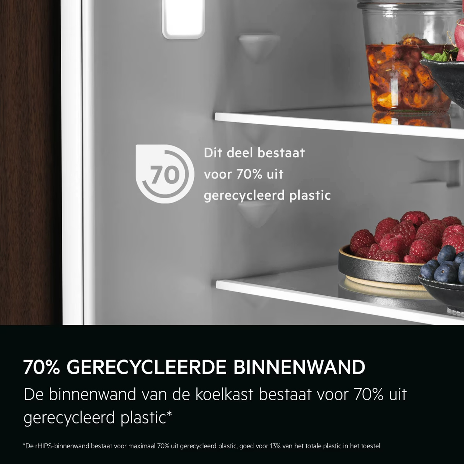 Refrigerator interior with shelves holding food, highlighting 70 percent recycled plastic inner wall.