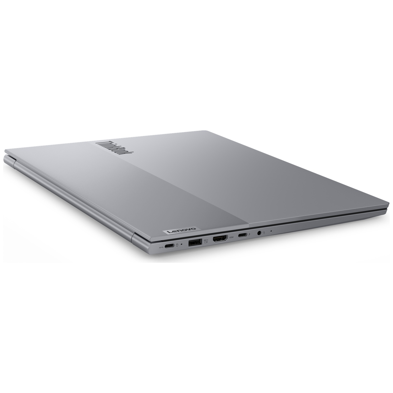 Gesloten grijze Lenovo ThinkBook laptop op een witte achtergrond, met zichtbare poorten en tweekleurigdeksel.