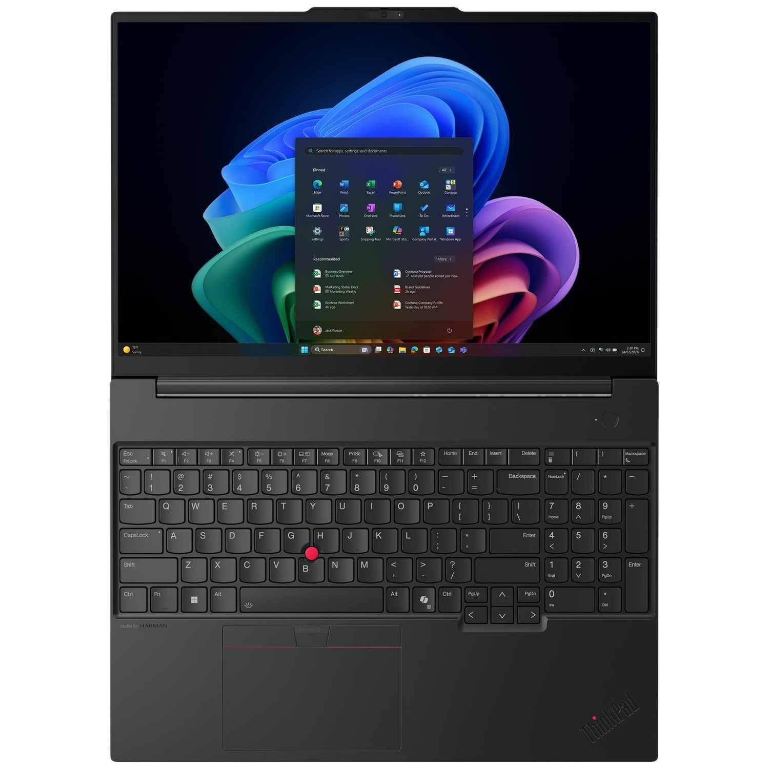 Een zwarte laptop toont het Windows-bureaublad met een kleurrijke achtergrond en een geopend startmenu.